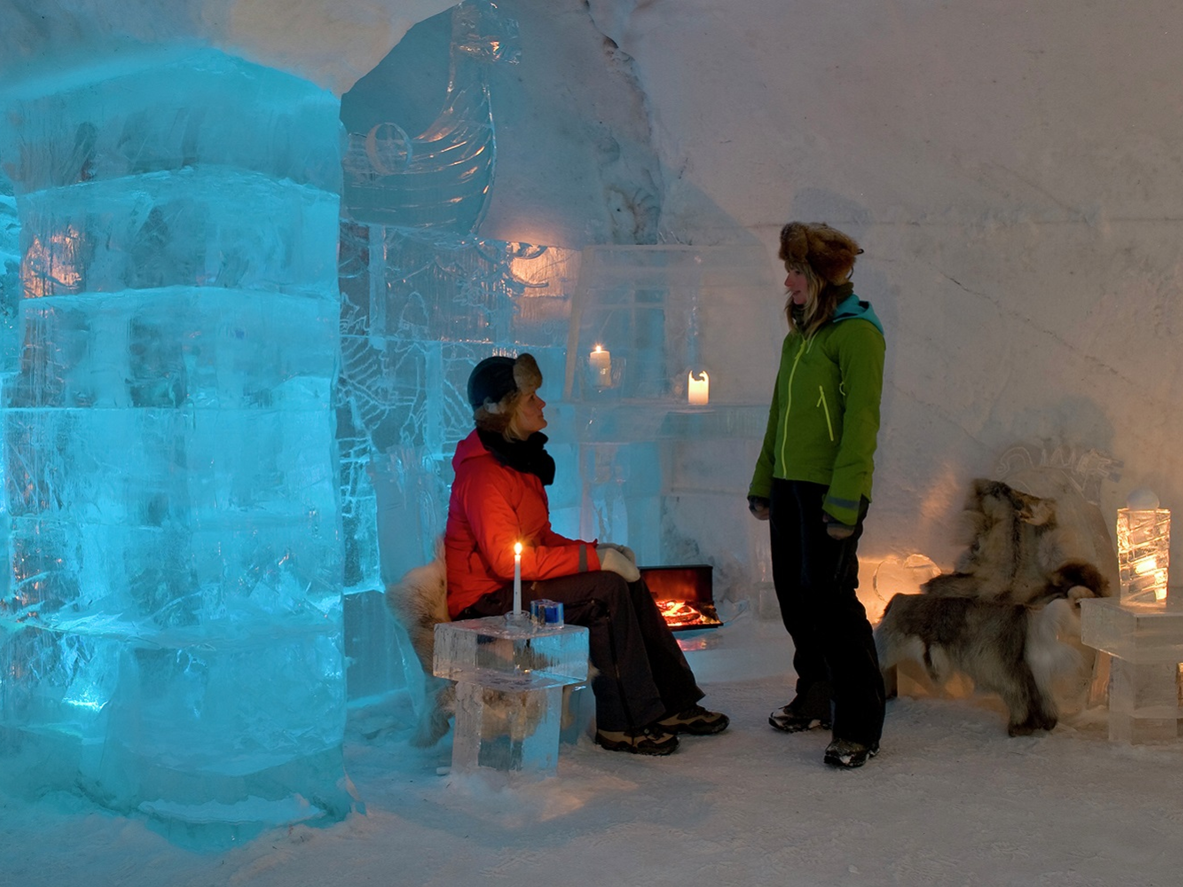 A couple inside the Sorrisniva Igloo Hotel in Alta, Northern Norway