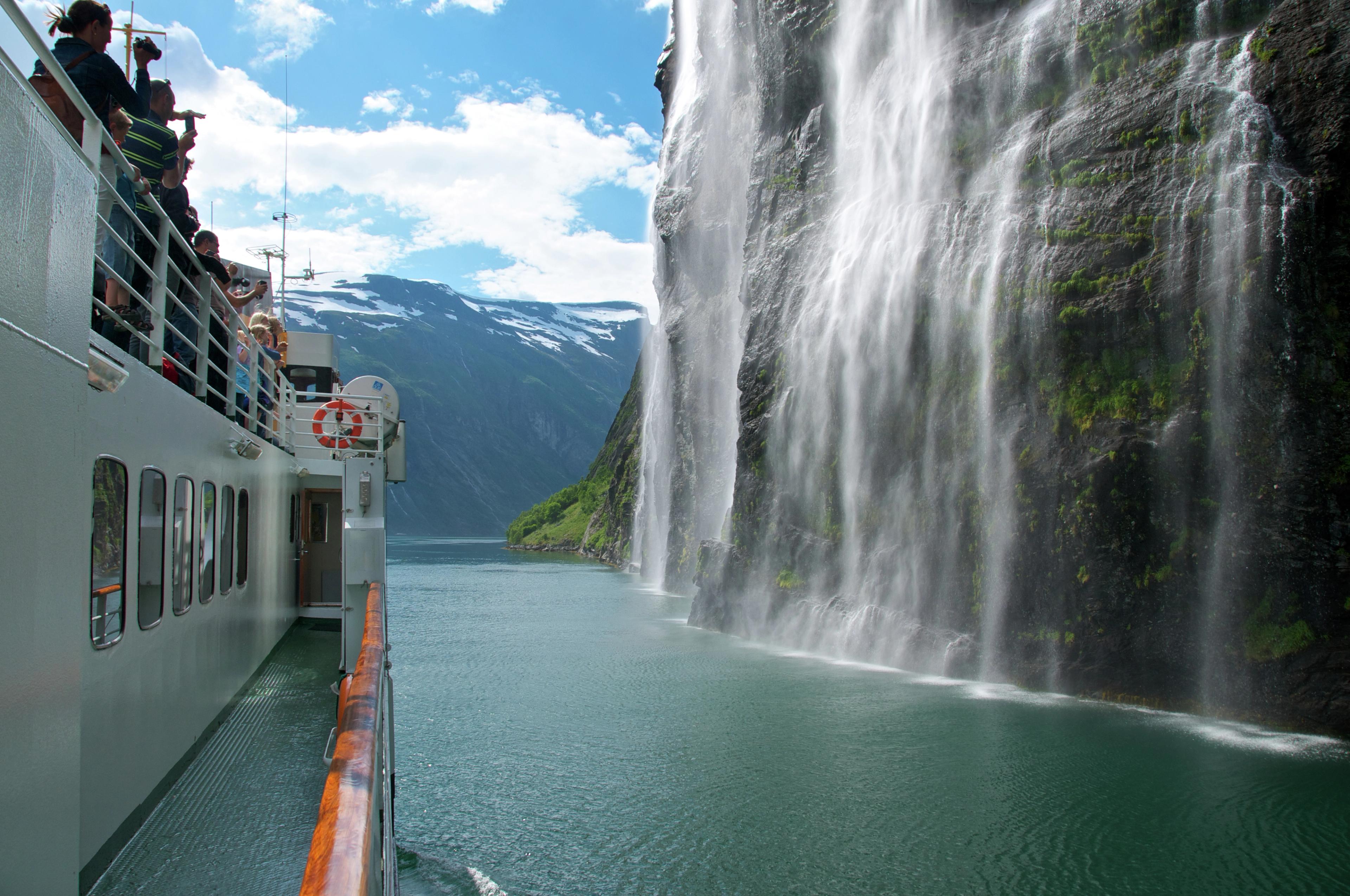Cruising by Brudesløret Waterfall in Geiranger, Fjord Norway