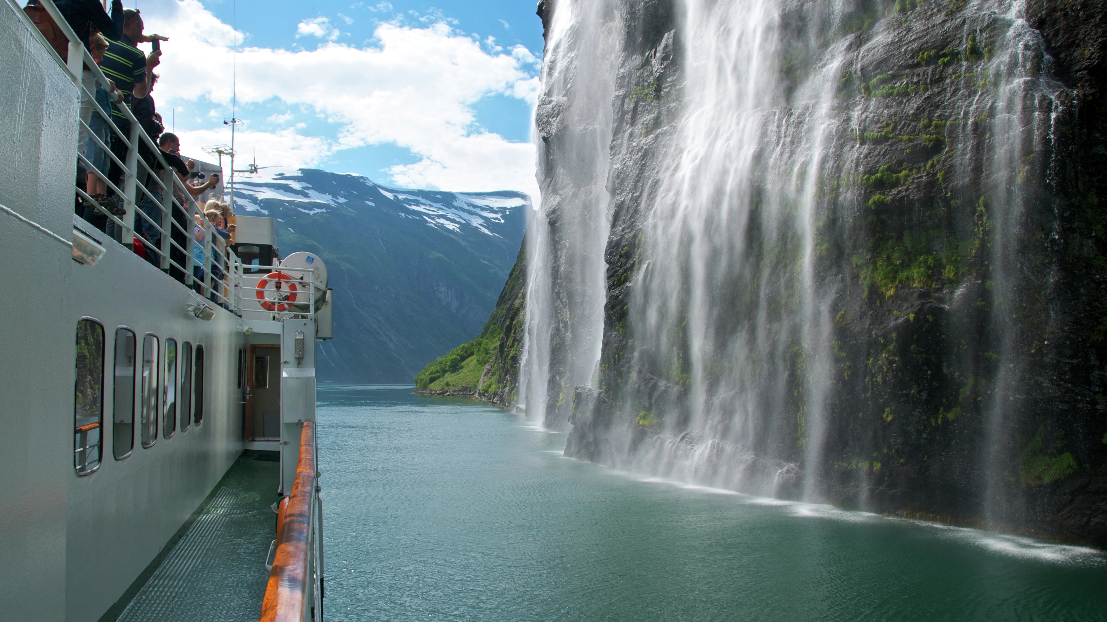 Cruising by Brudesløret Waterfall in Geiranger, Fjord Norway