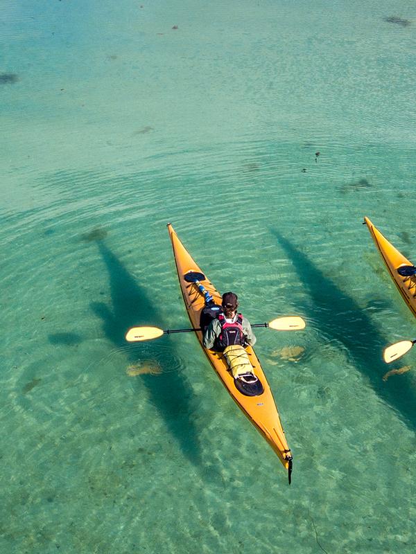 Two kayakers on the water close to Herøy in Helgeland, Northern Norway.
