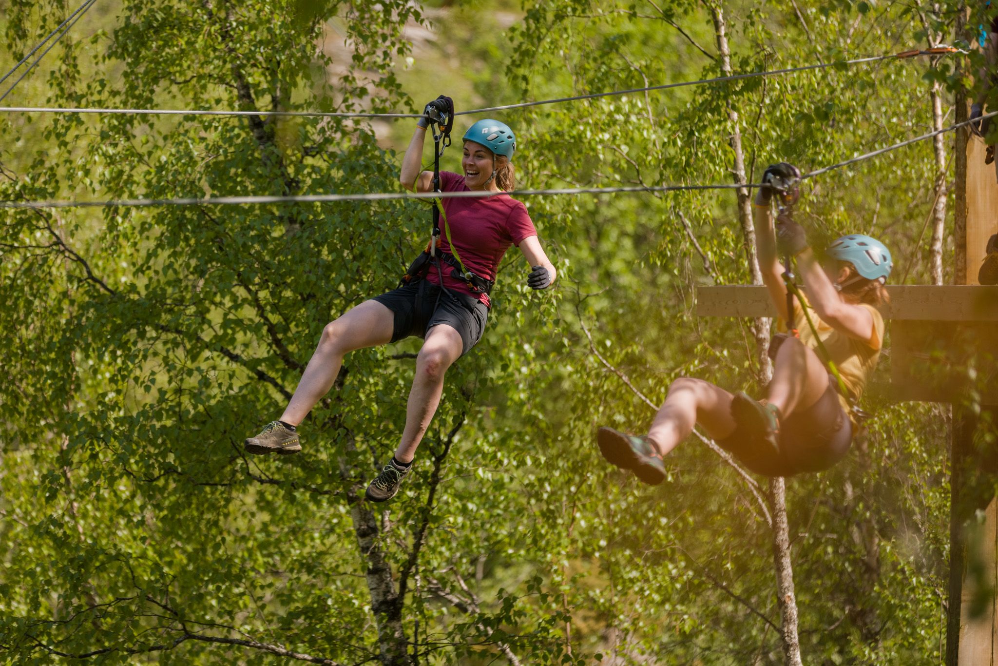 Women ziplining in Geiranger