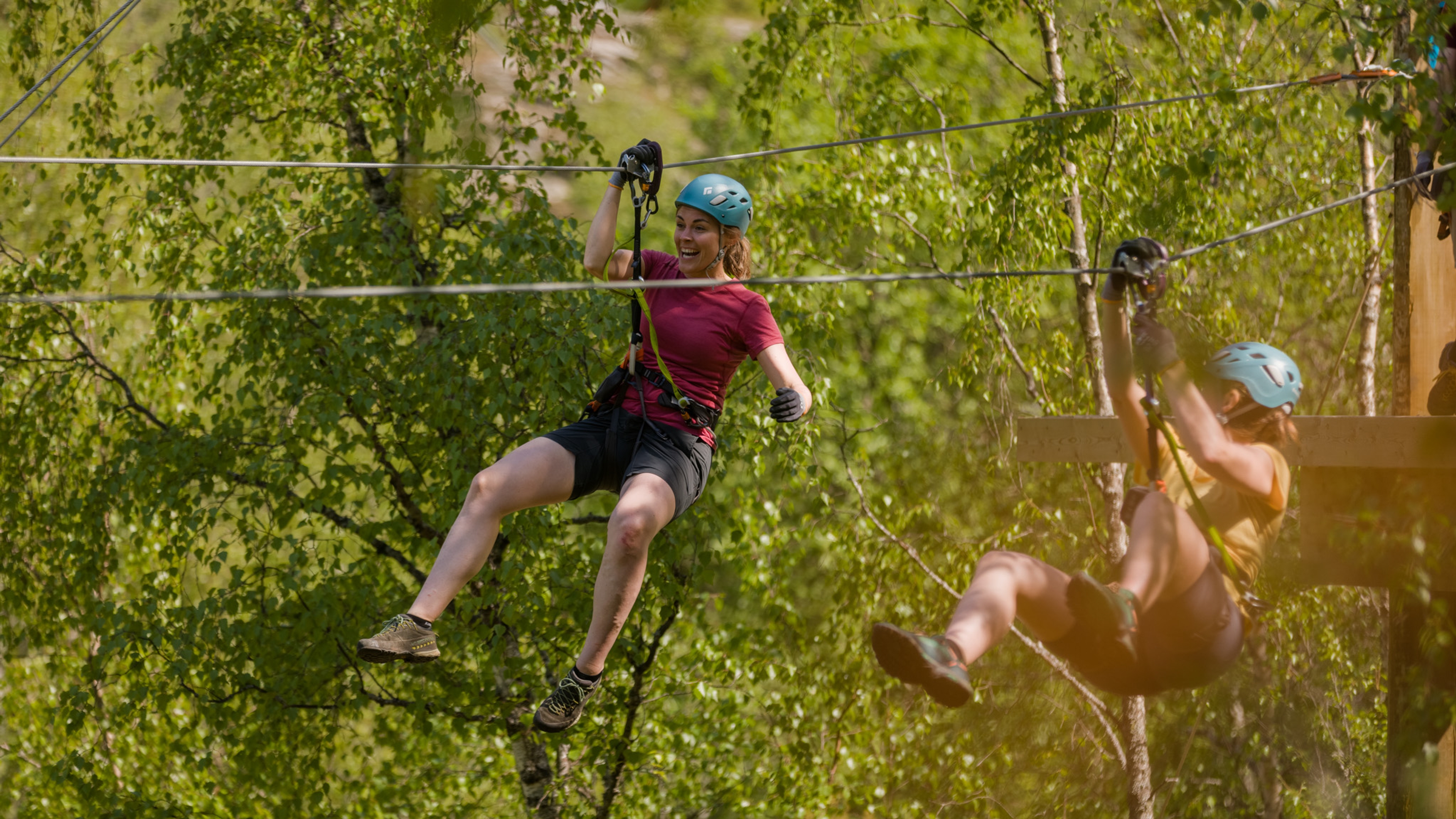 Women ziplining in Geiranger