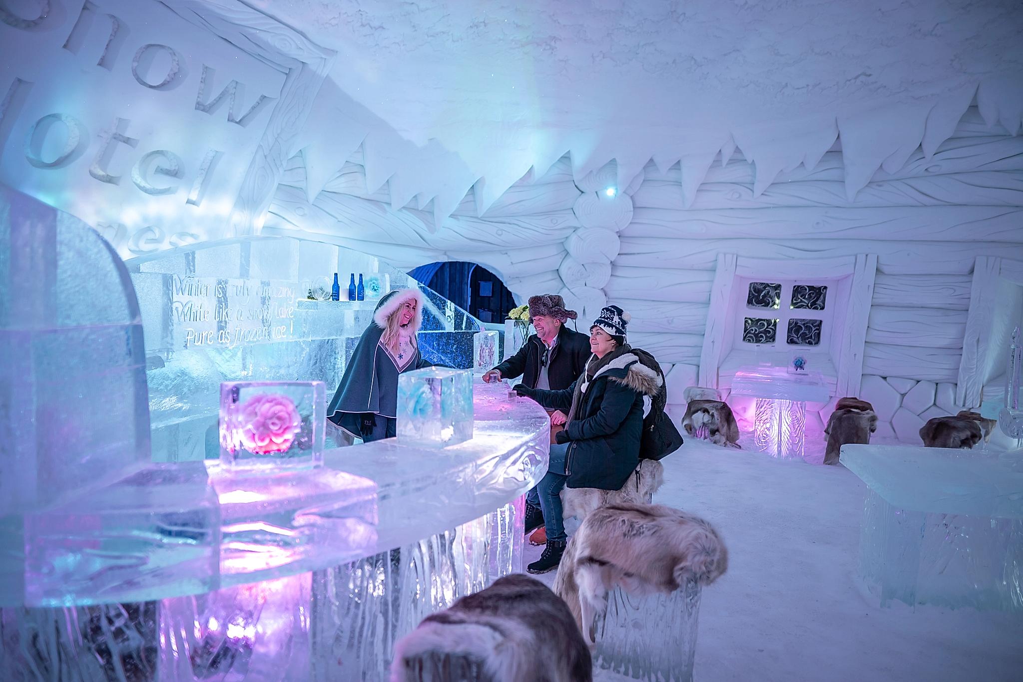 Guests in the ice bar at Snowhotel Kirkenes