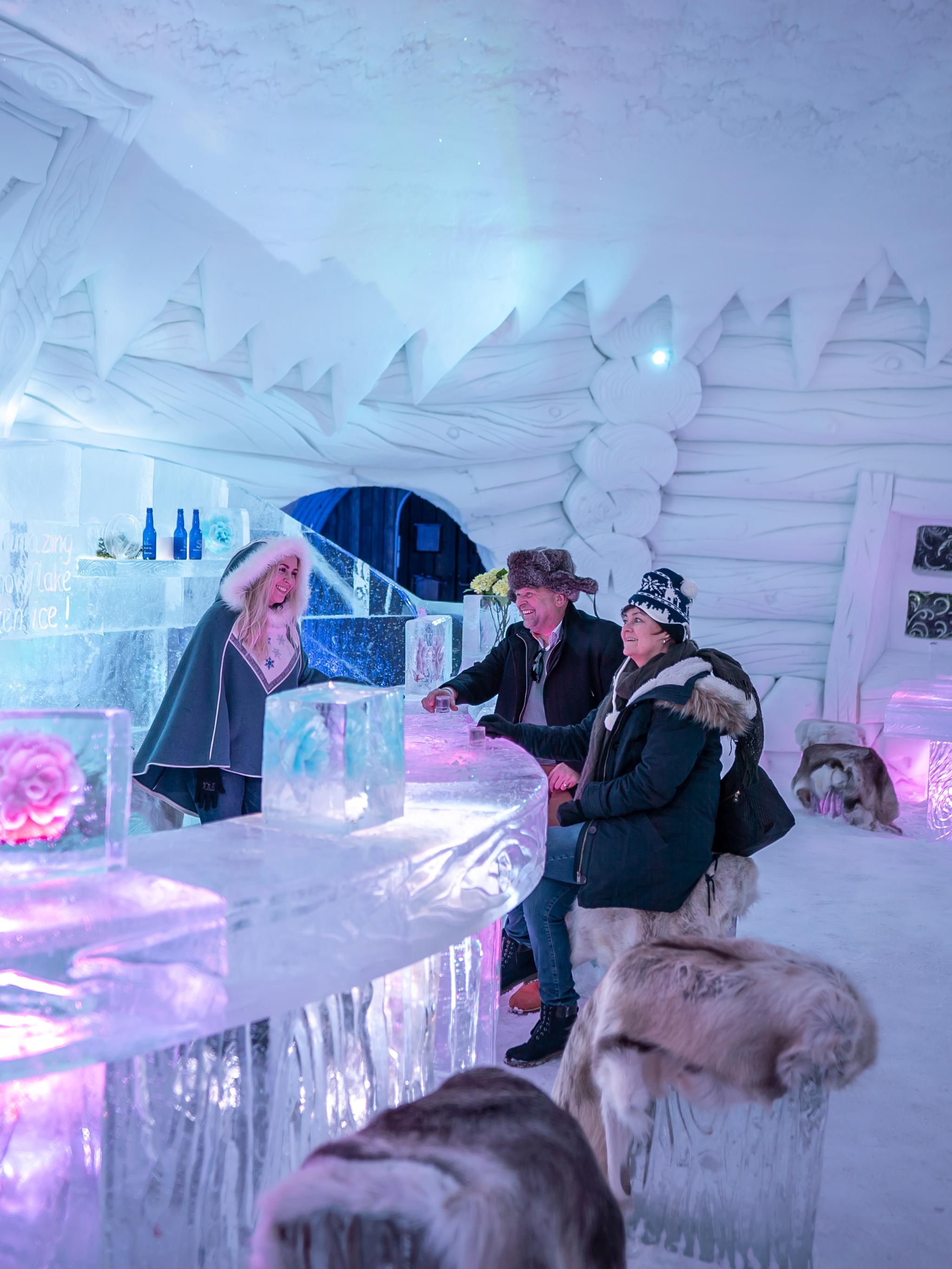 Guests in the ice bar at Snowhotel Kirkenes