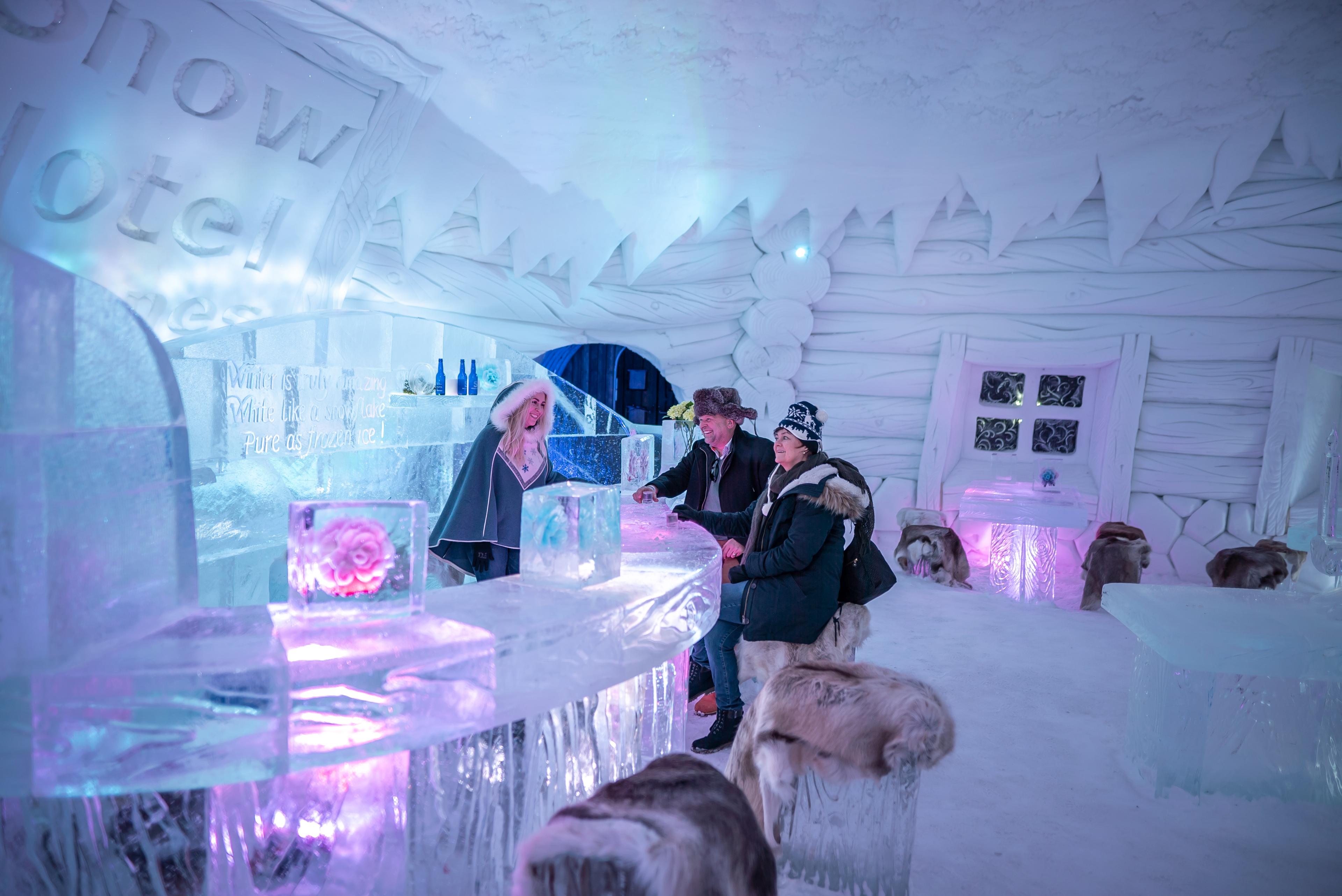 Guests in the ice bar at Snowhotel Kirkenes