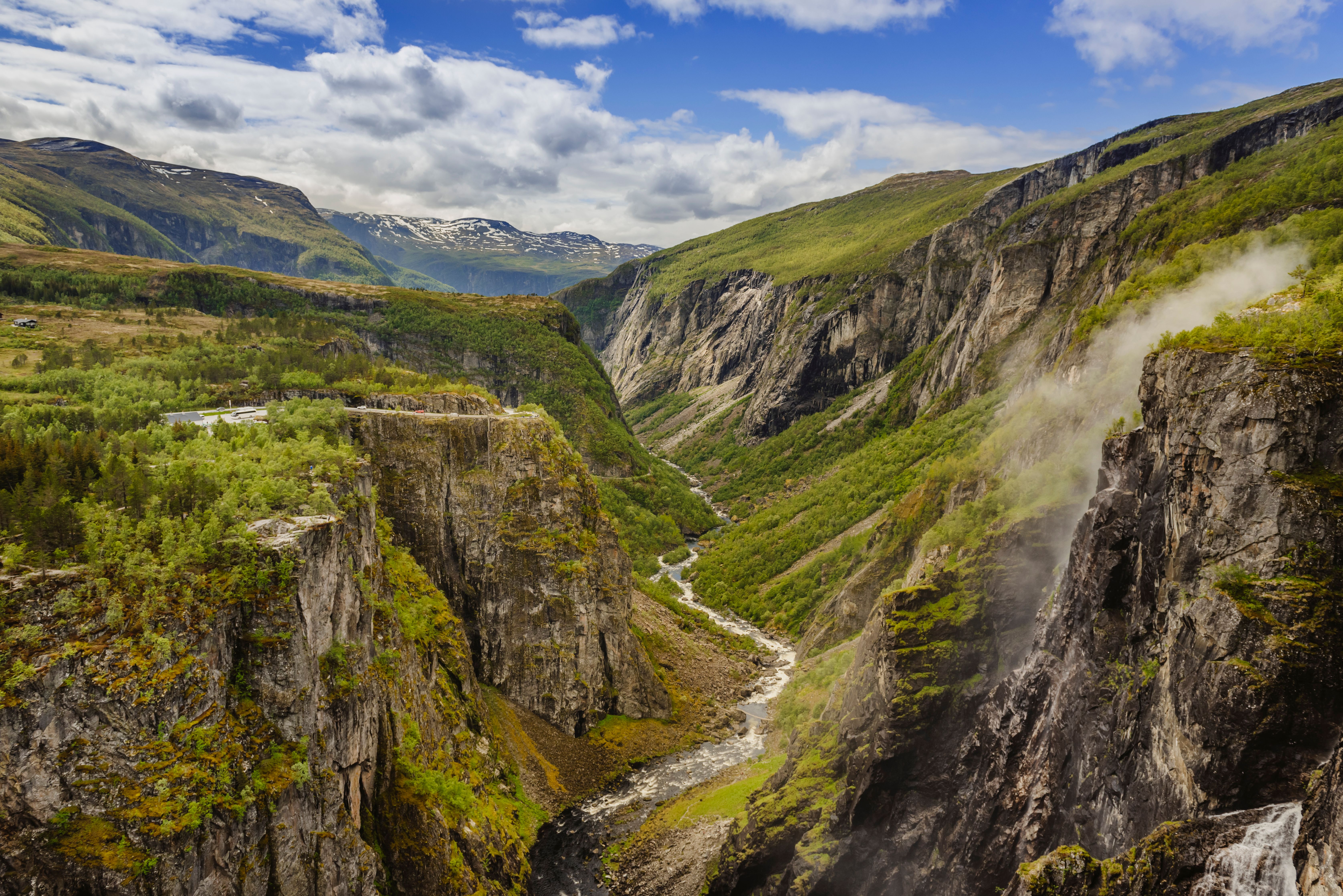 A lush valley with a river below