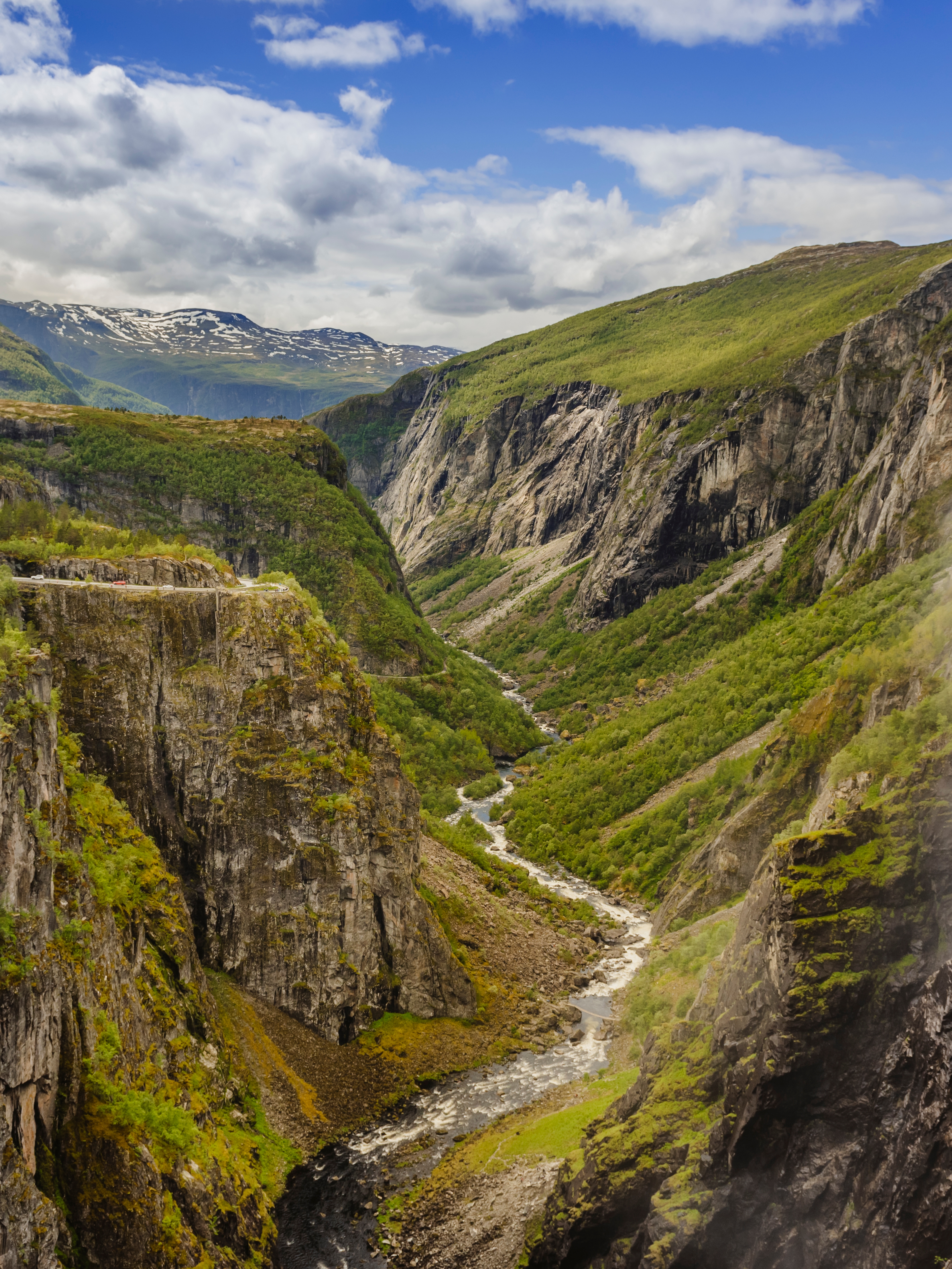 A lush valley with a river below