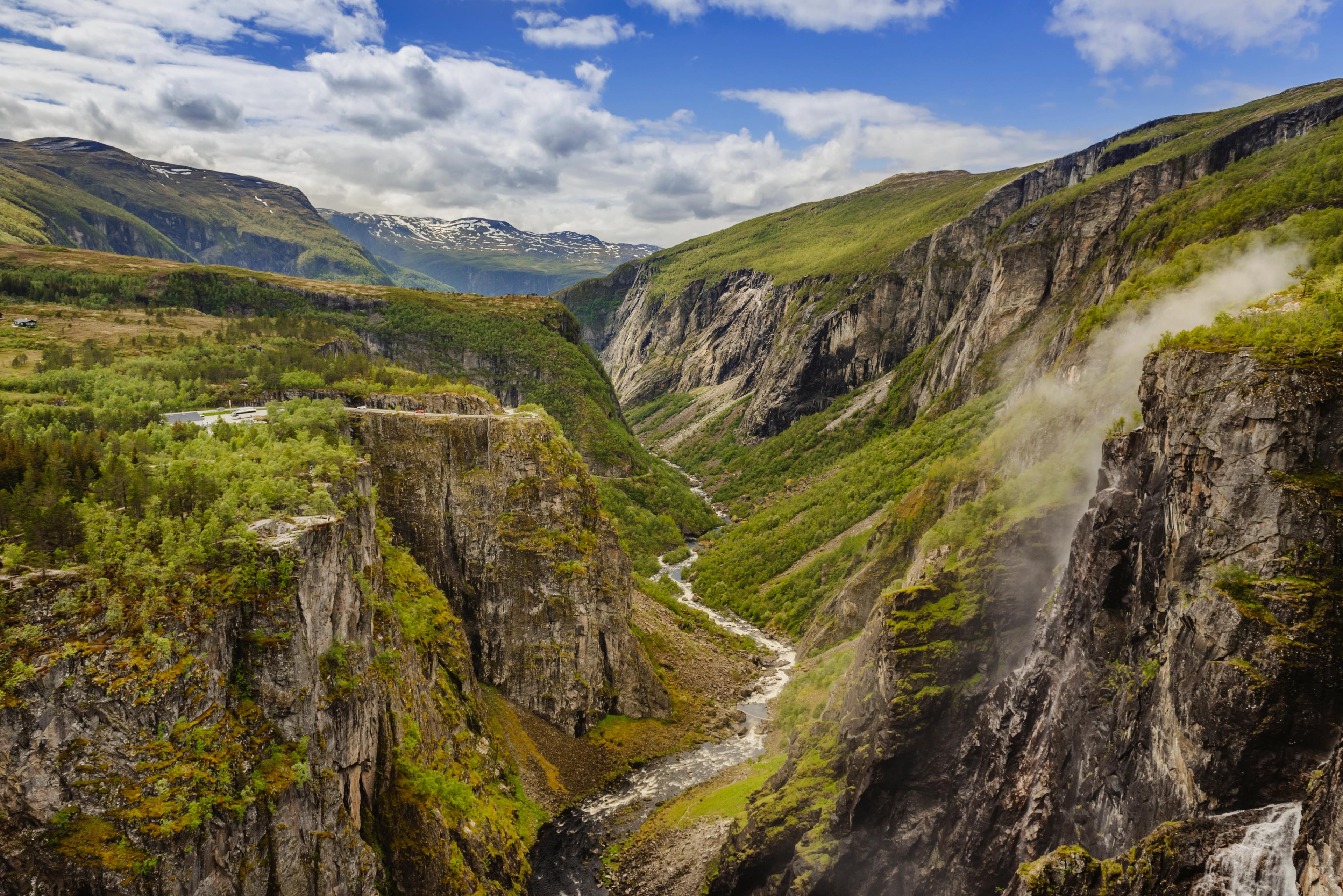 A lush valley with a river below