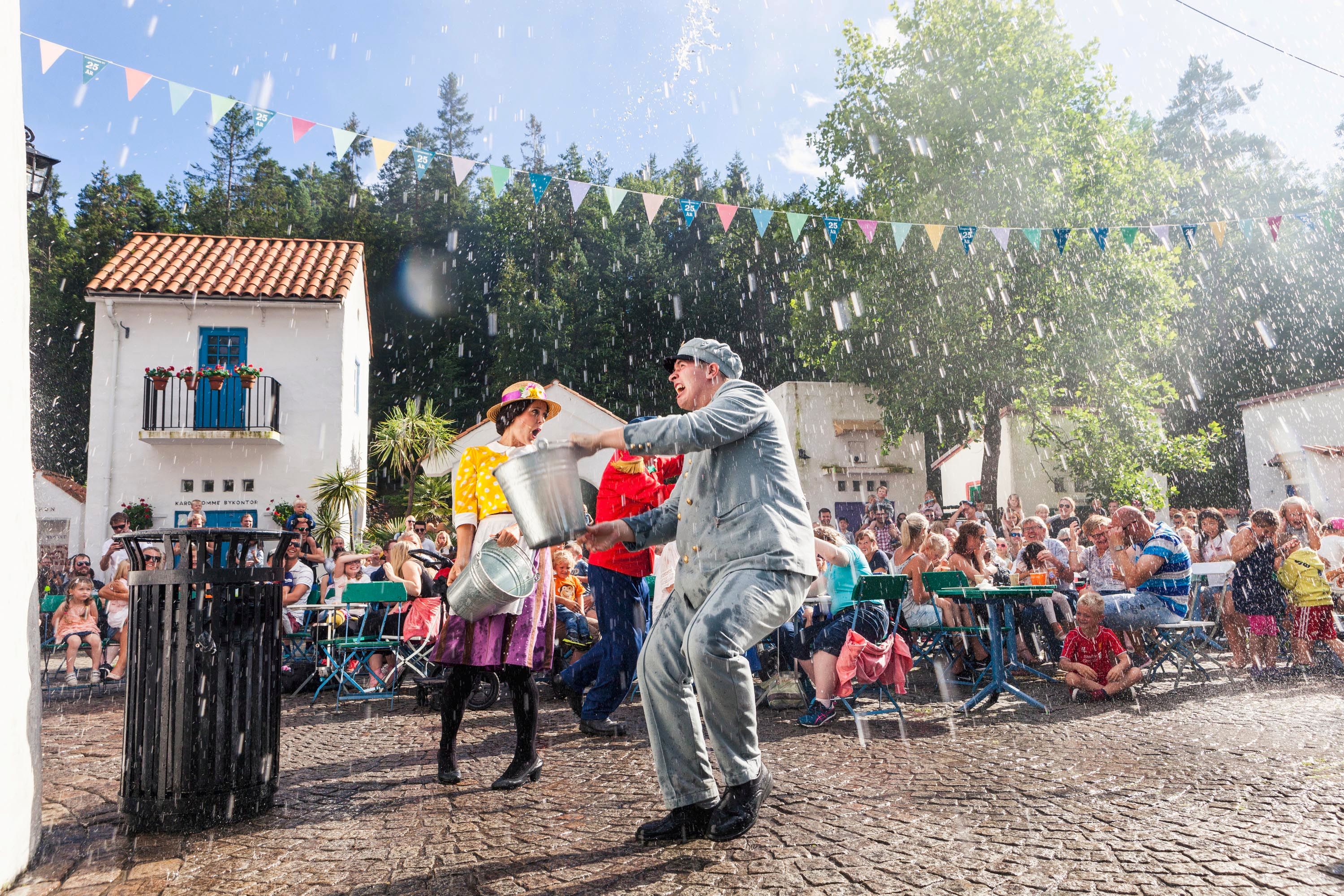 Actors in a scene in Kardemomme by in Dyreparken Zoo, Kristiansand. Southern Norway.