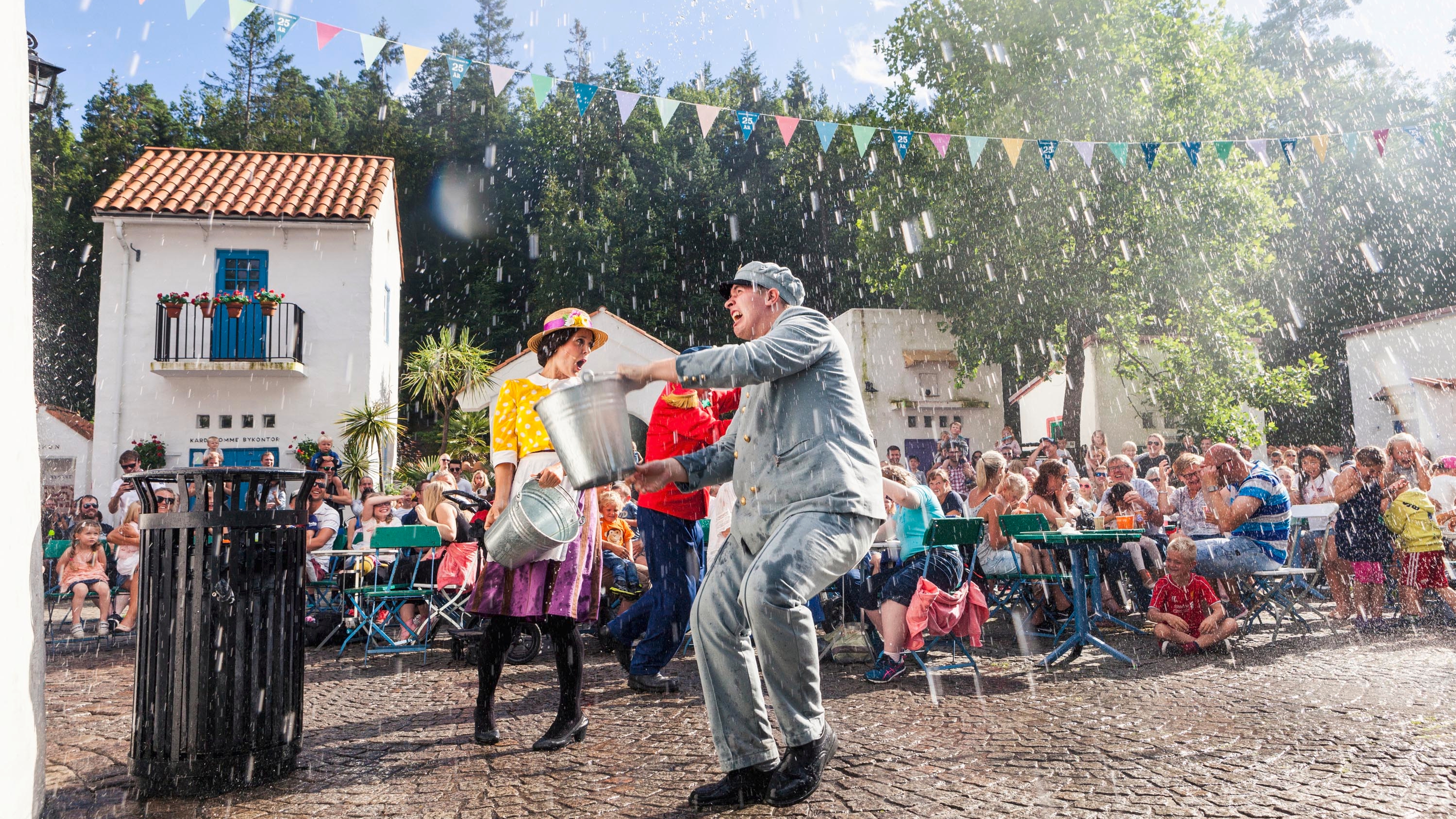 Actors in a scene in Kardemomme by in Dyreparken Zoo, Kristiansand. Southern Norway.
