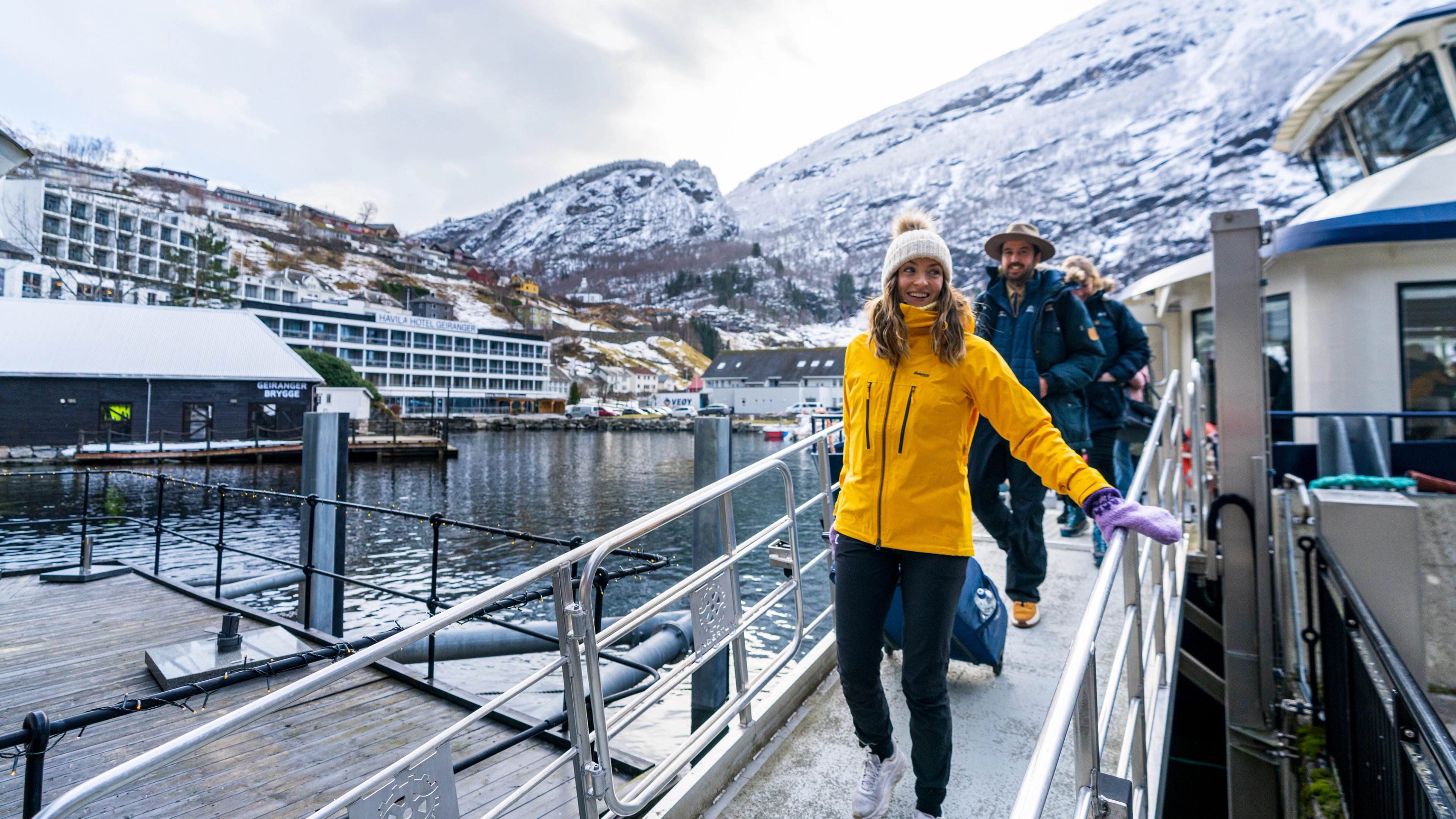 Passengers disembarks the Fjordrangers cruise boat in Geiranger