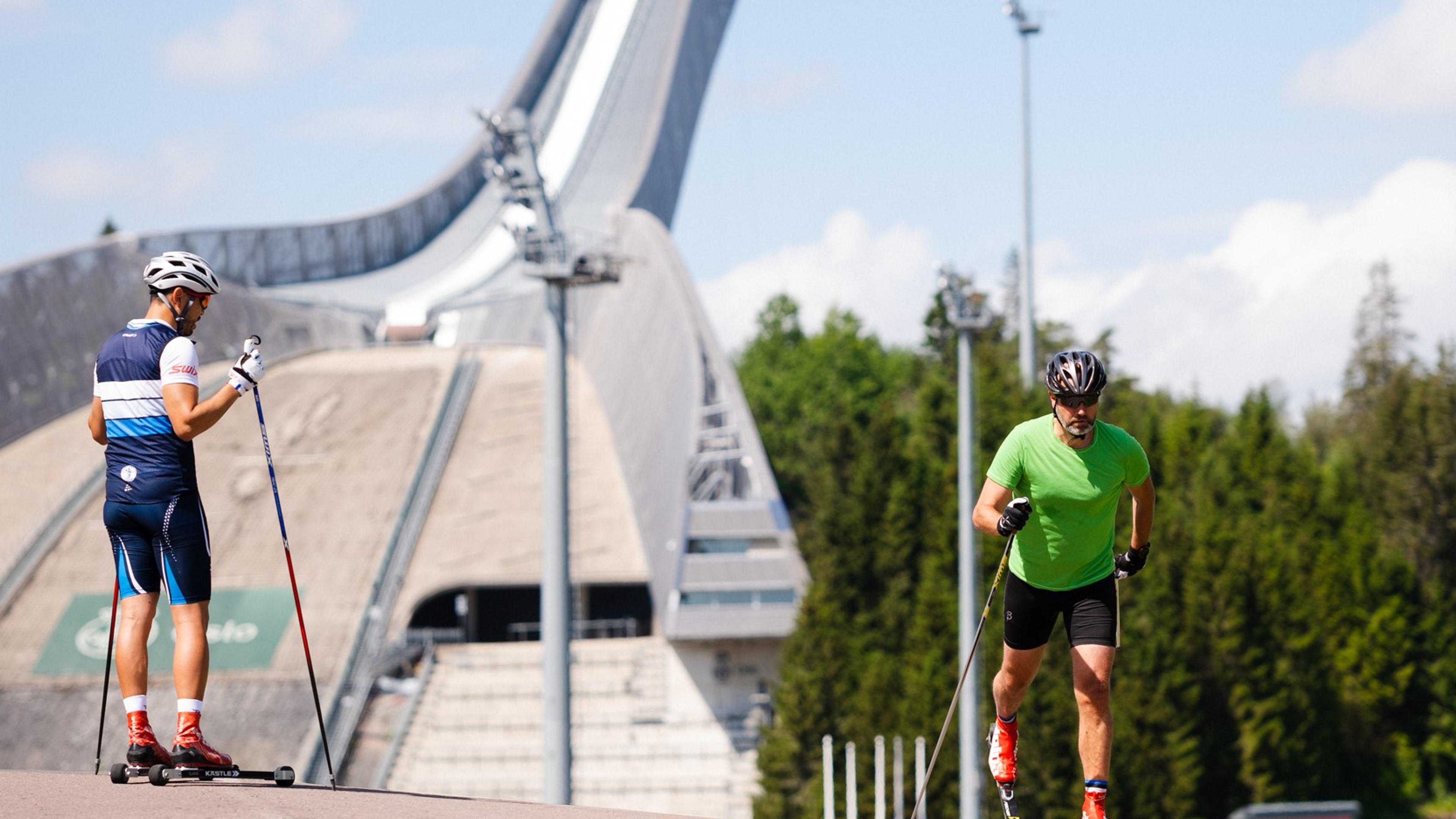 Two men on roller skis at Holmenkollen in Norway
