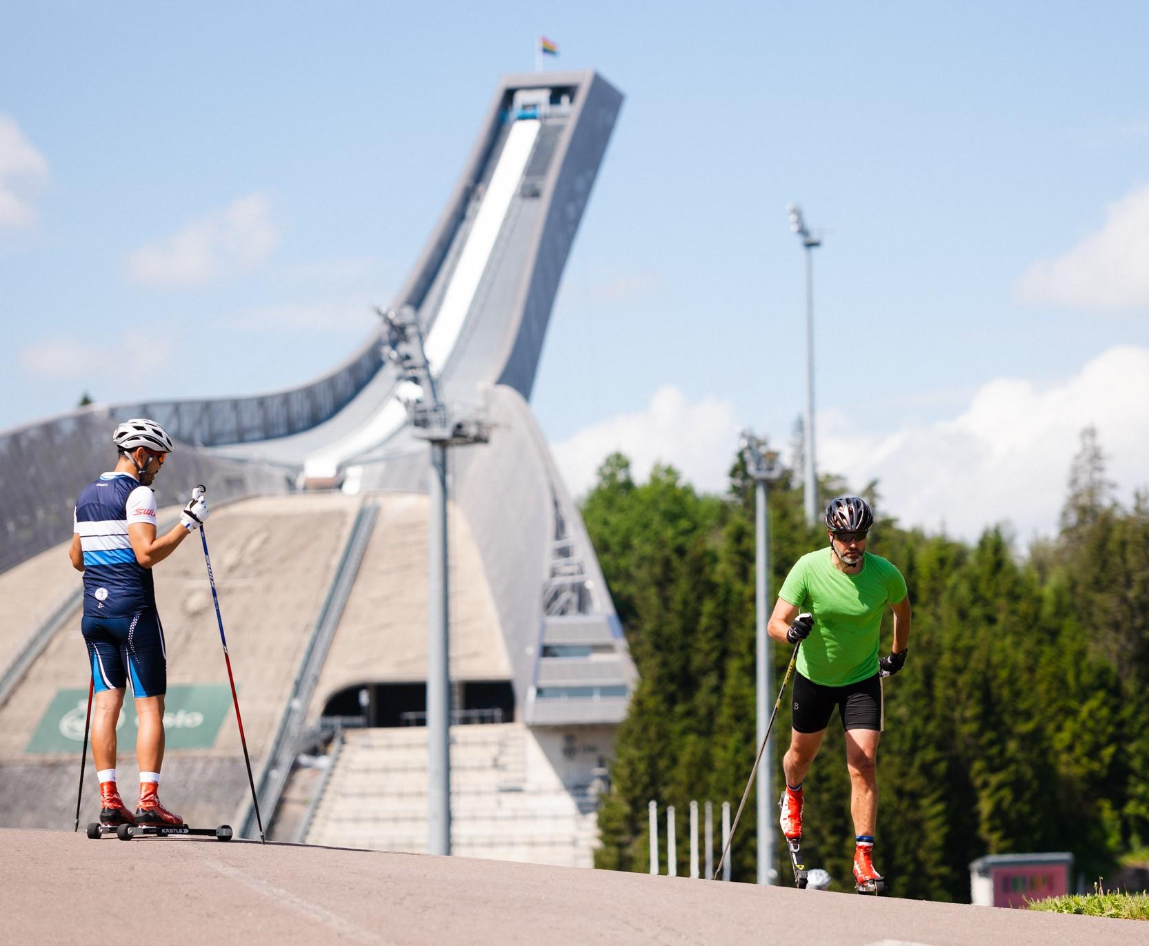 Two men on roller skis at Holmenkollen in Norway