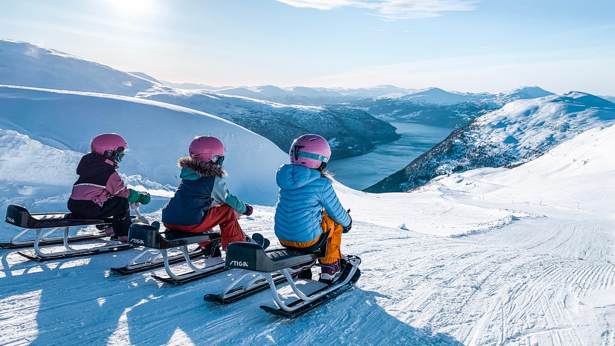 Girls on sleds at Loen Skylift, Norway.