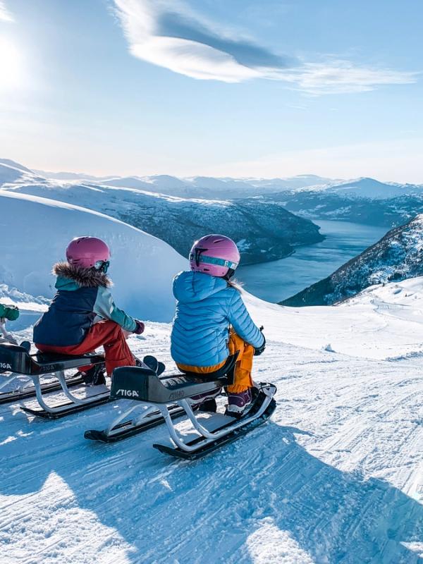 Girls on sleds at Loen Skylift, Norway.