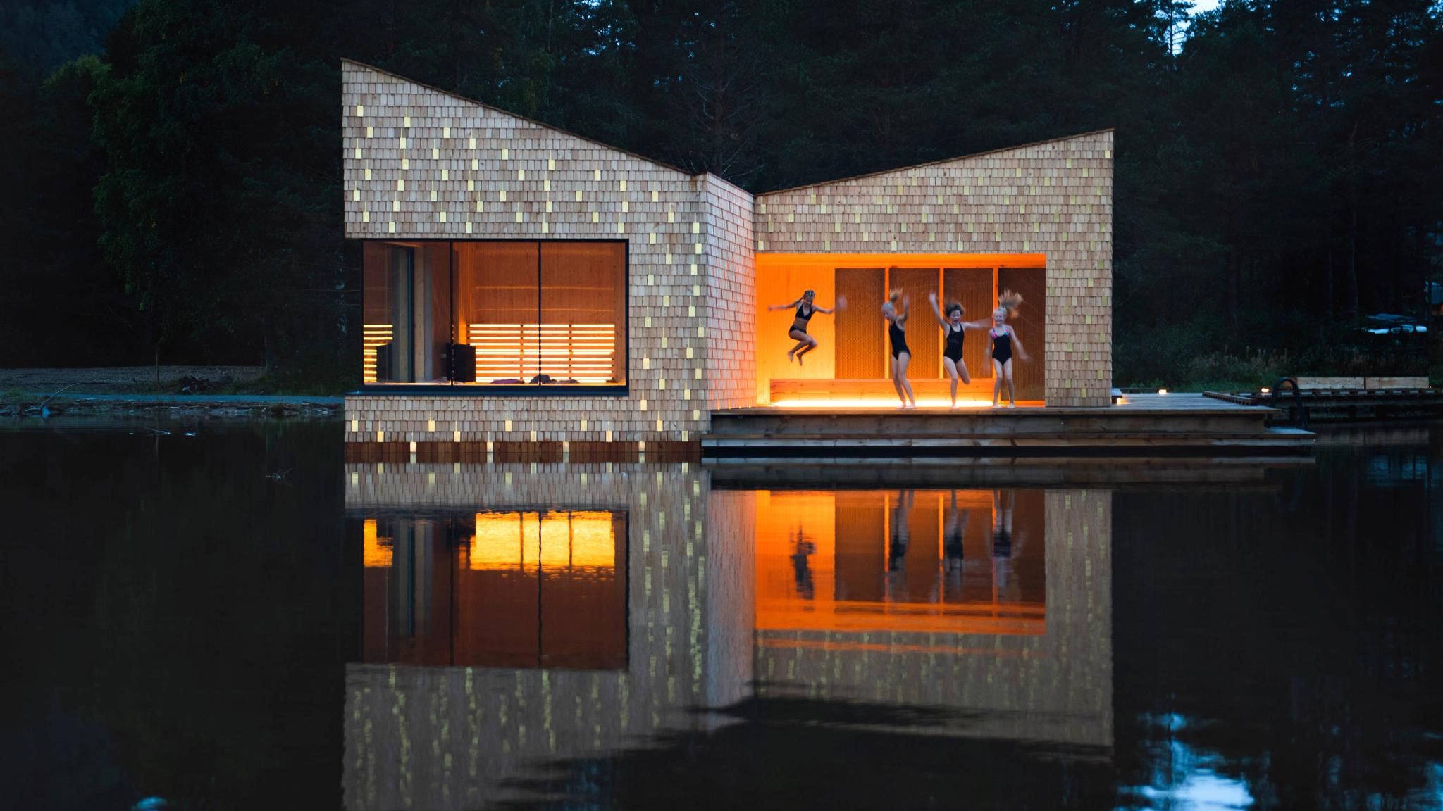 People jumping into the lake from the Soria Moria sauna in Telemark, Eastern Norway