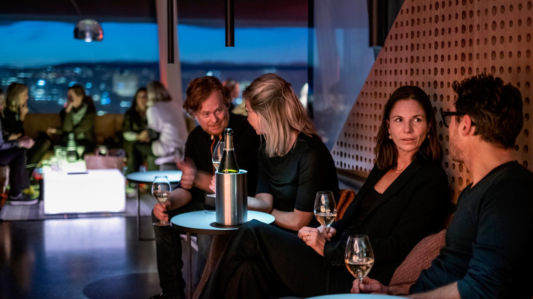 People enjoying a drink at Kranen cocktail bar at MUNCH, Oslo