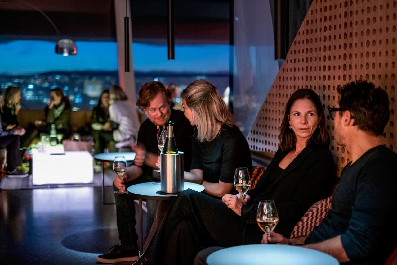 People enjoying a drink at Kranen cocktail bar at MUNCH, Oslo