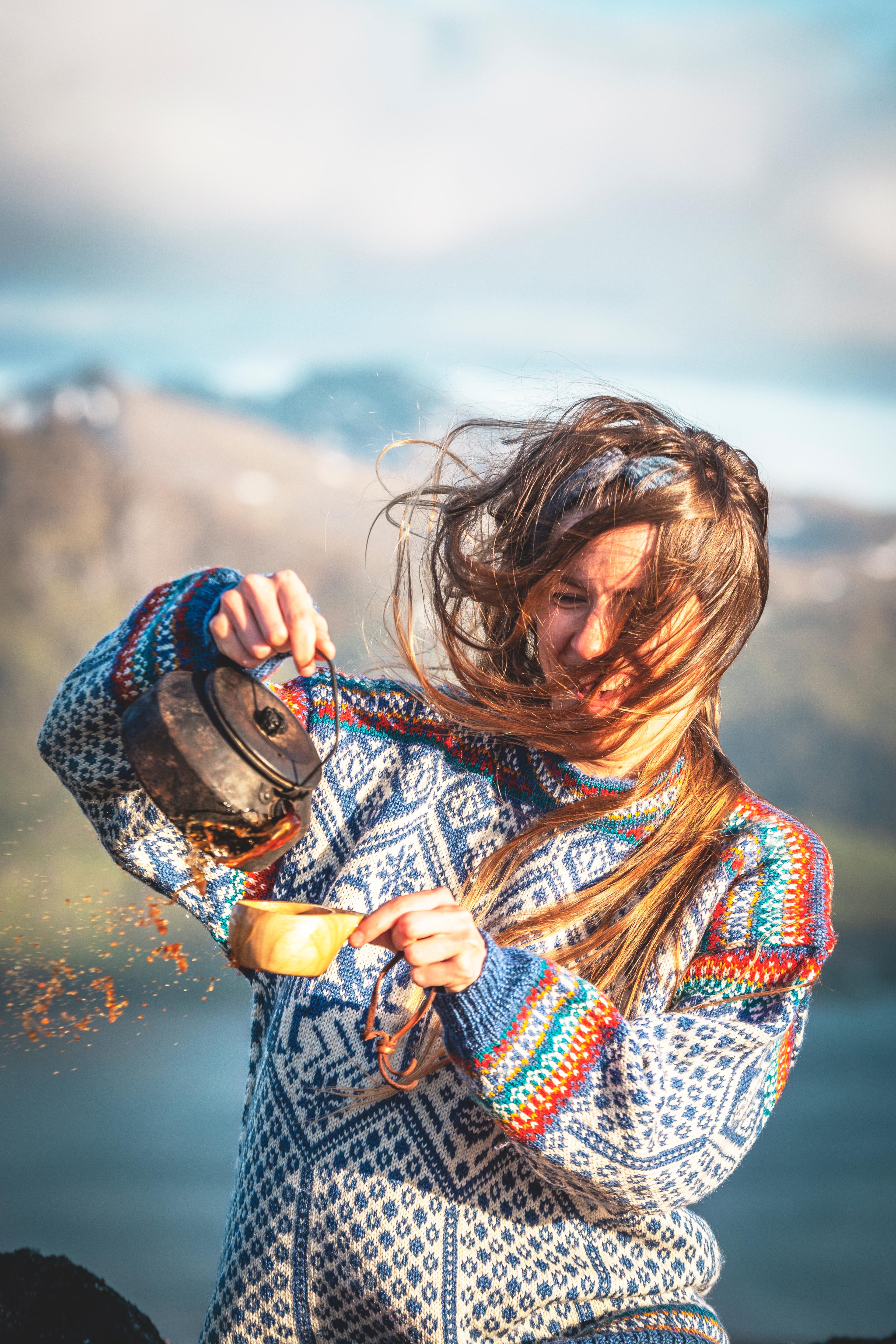 Woman drinking coffee in the 1994 Lillehammer OL sweater