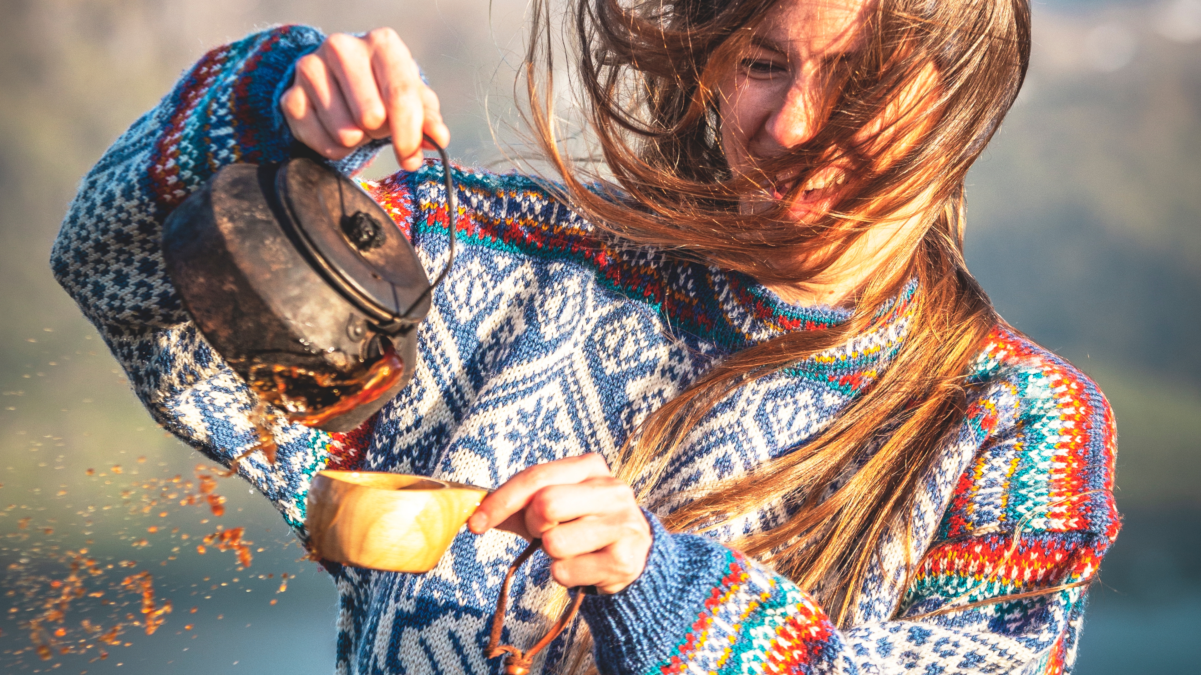 Woman drinking coffee in the 1994 Lillehammer OL sweater