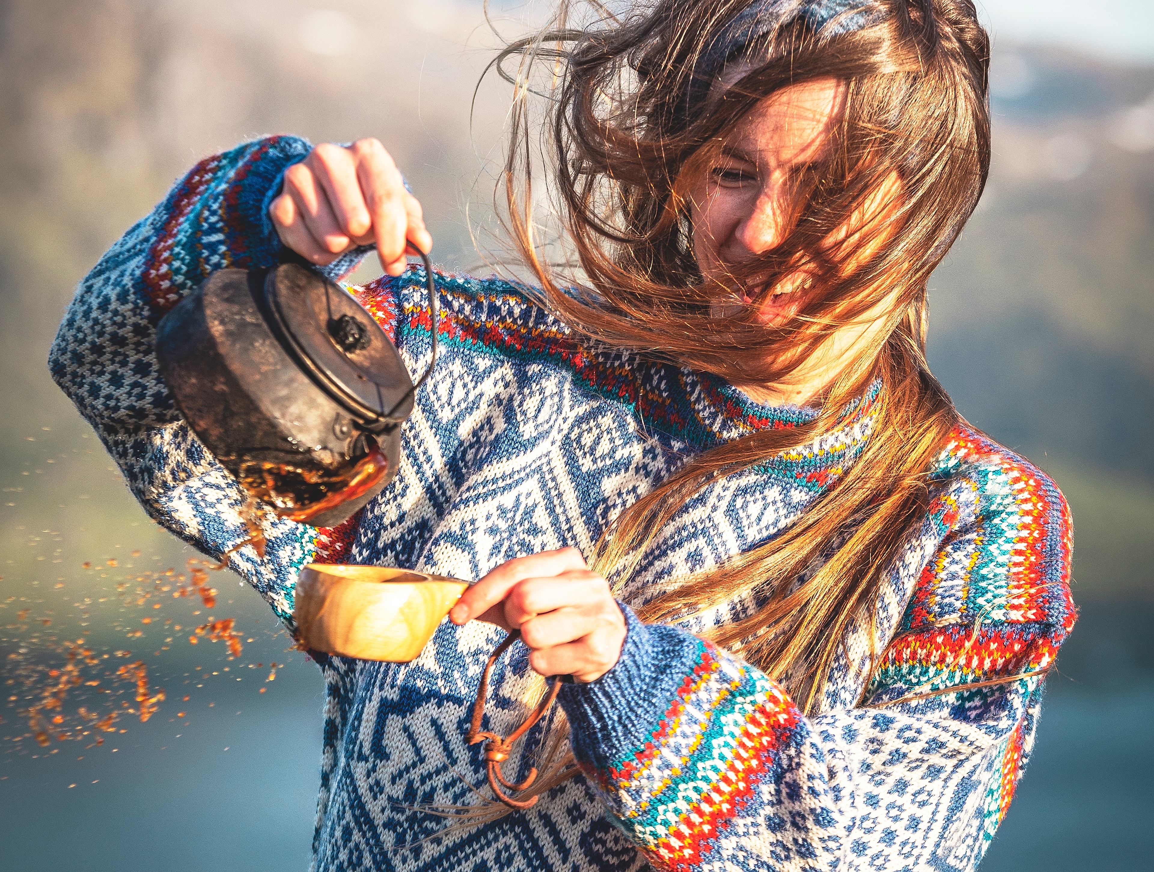 Woman drinking coffee in the 1994 Lillehammer OL sweater