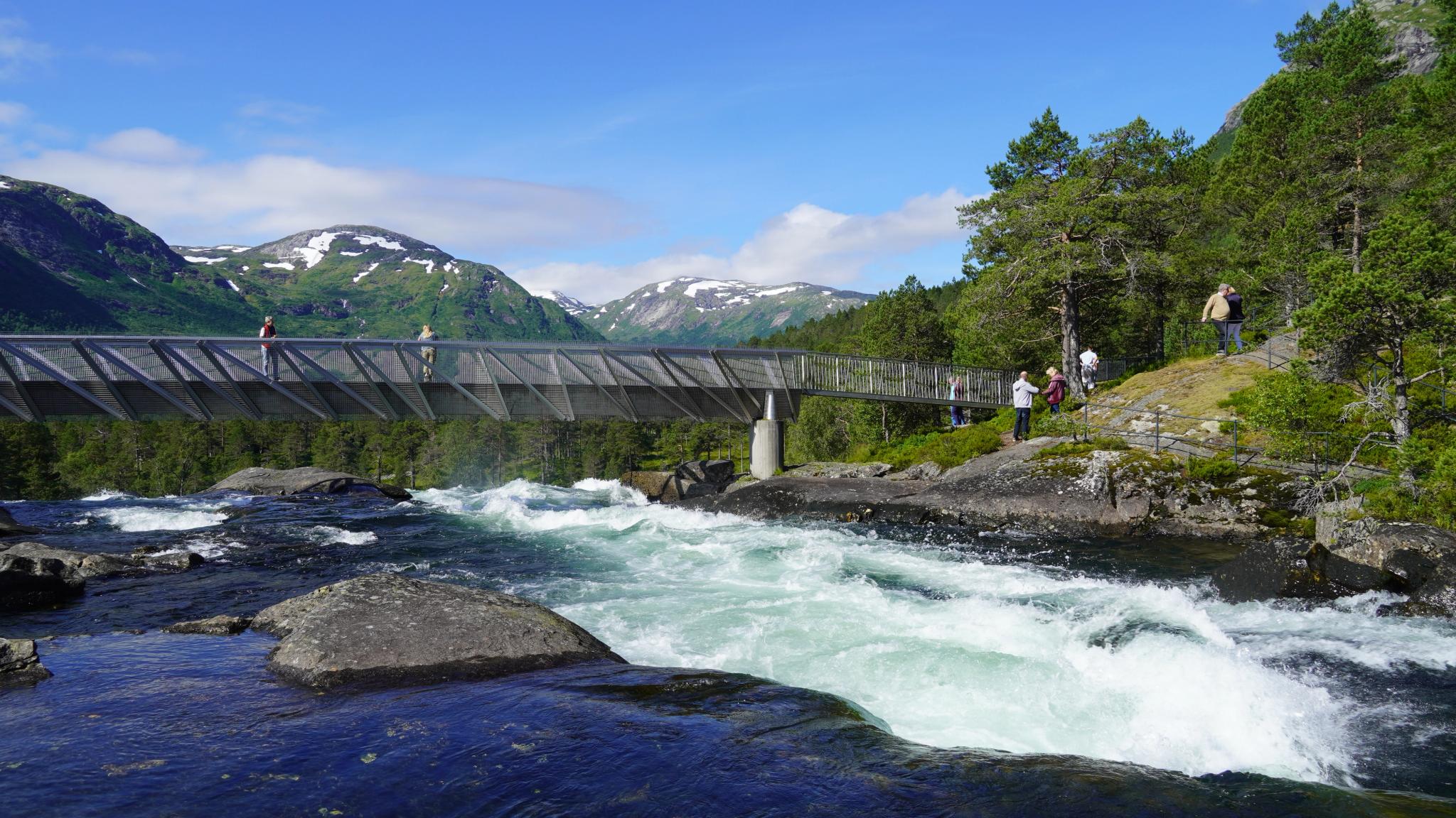 A metal bridge over the waterfall Likholefossen