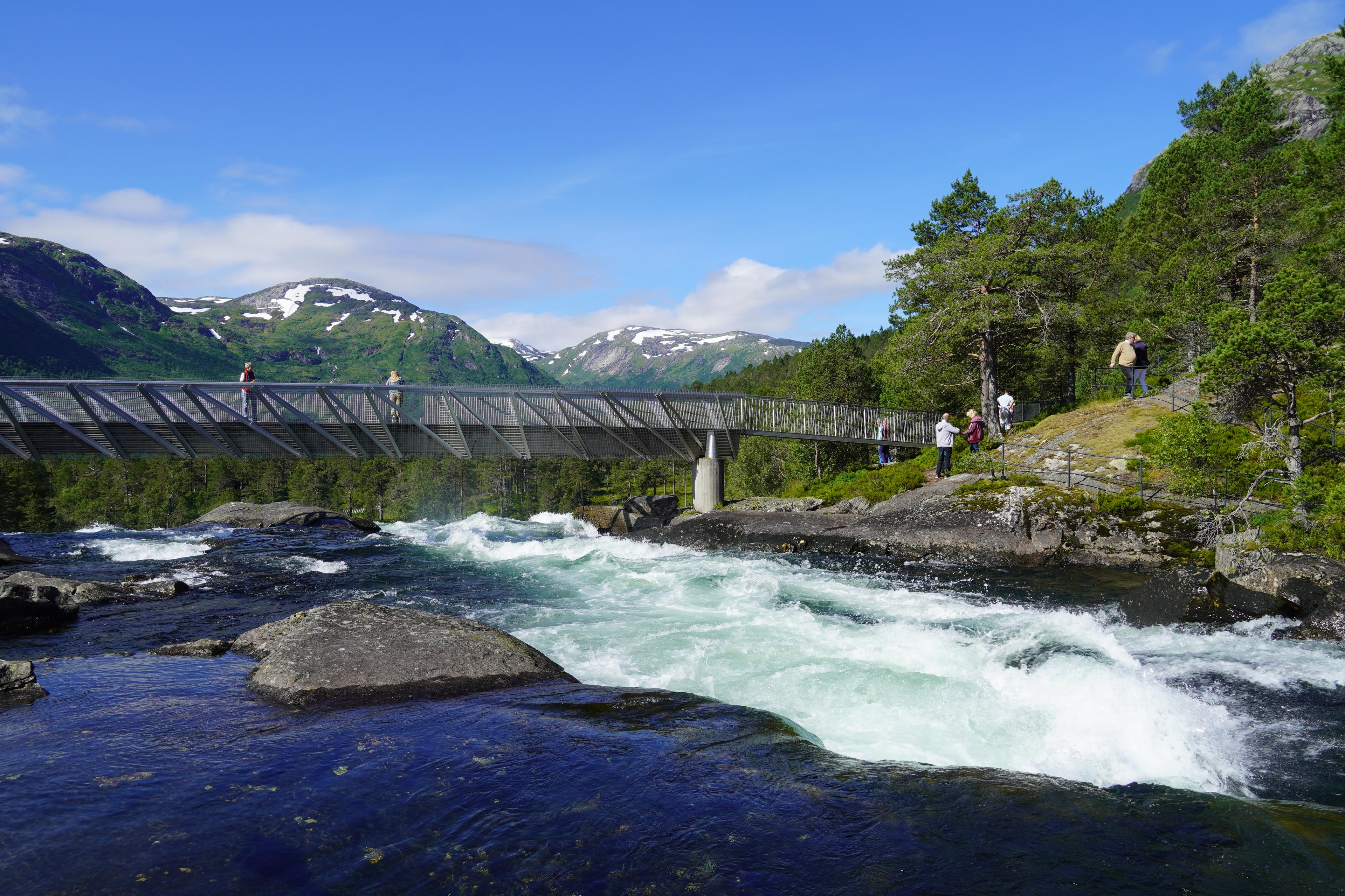 A metal bridge over the waterfall Likholefossen