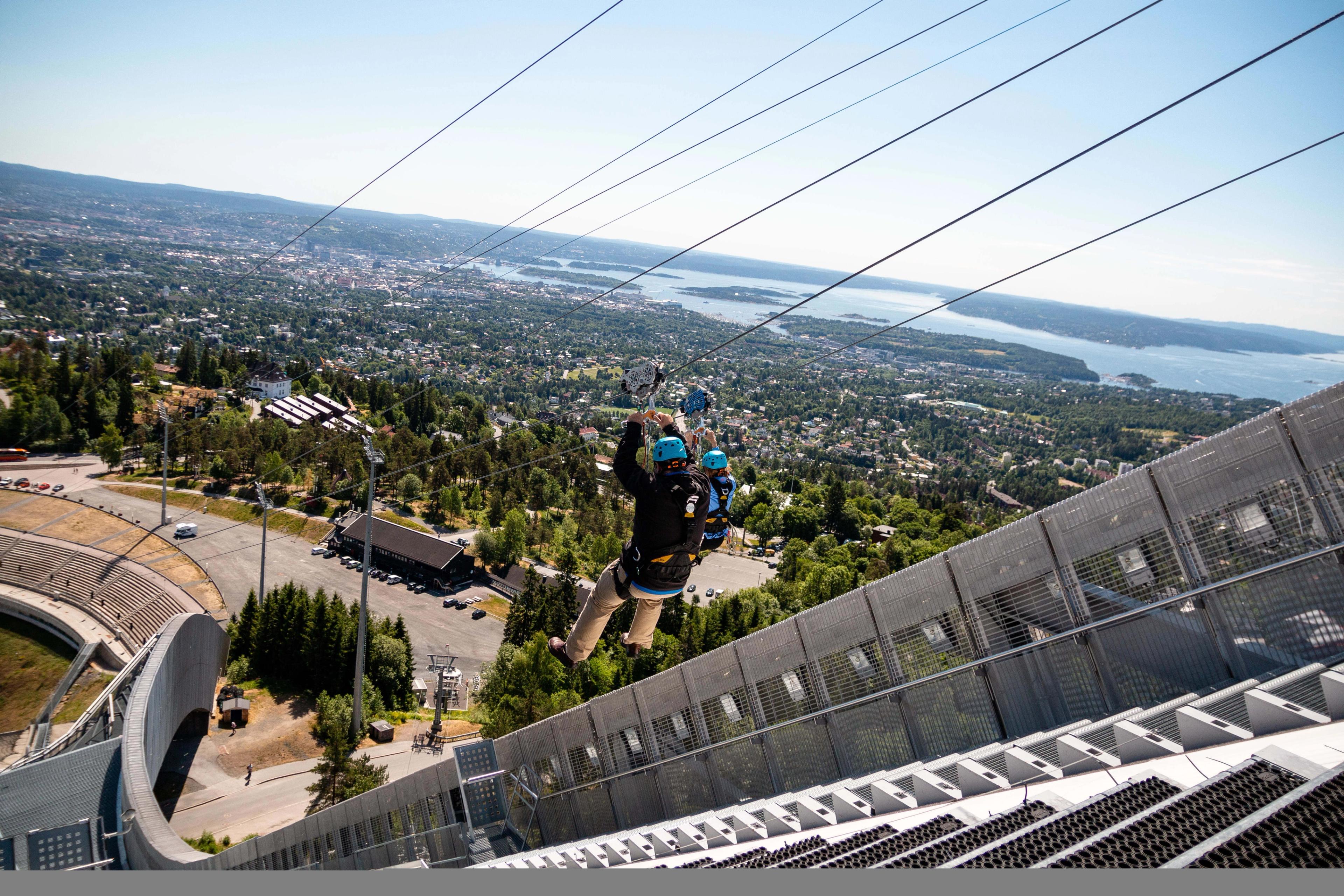 A person taking the zip line from the Holmenkollen Ski jump in Oslo.
