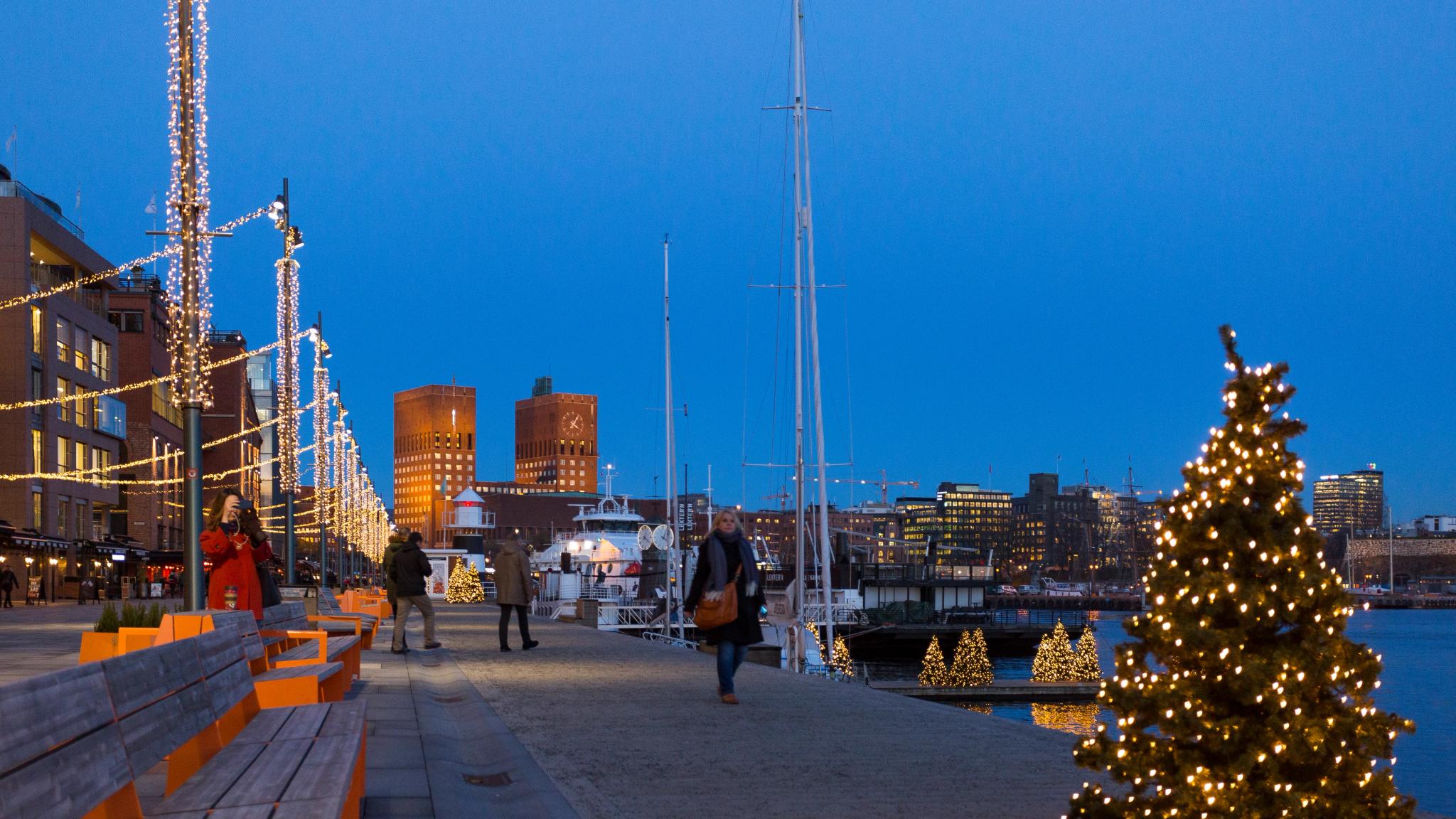 The harbour promenade at Aker Brygge is decorated with Christmas lights in Oslo
