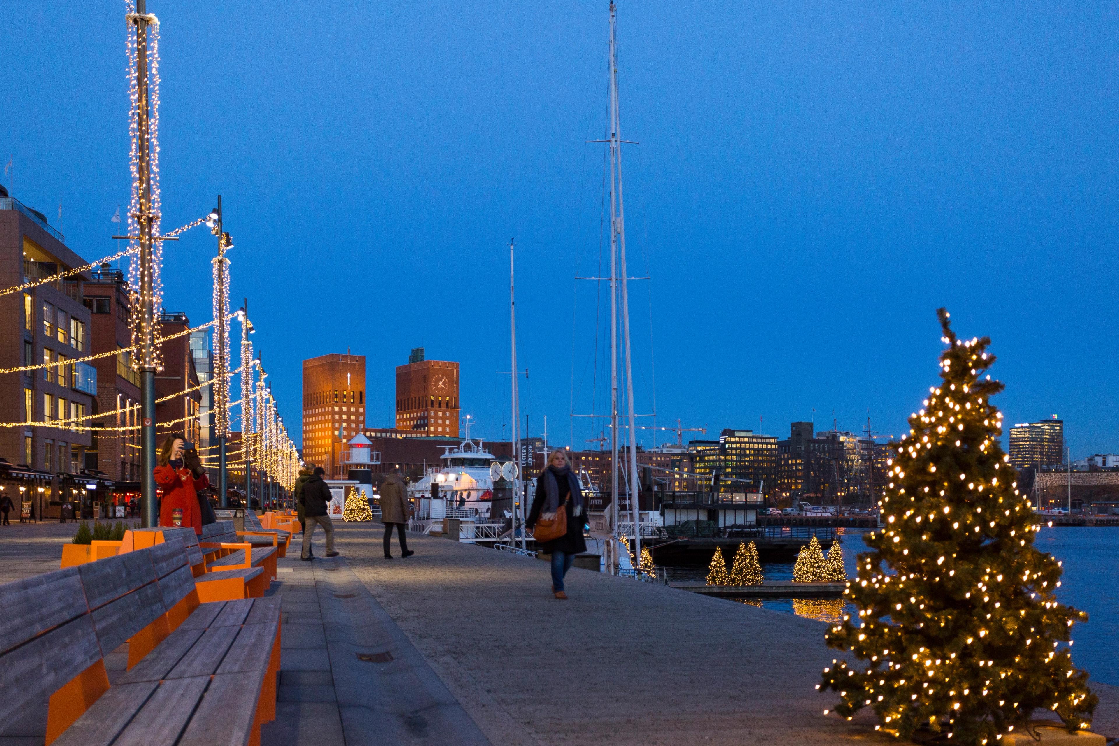 The harbour promenade at Aker Brygge is decorated with Christmas lights in Oslo