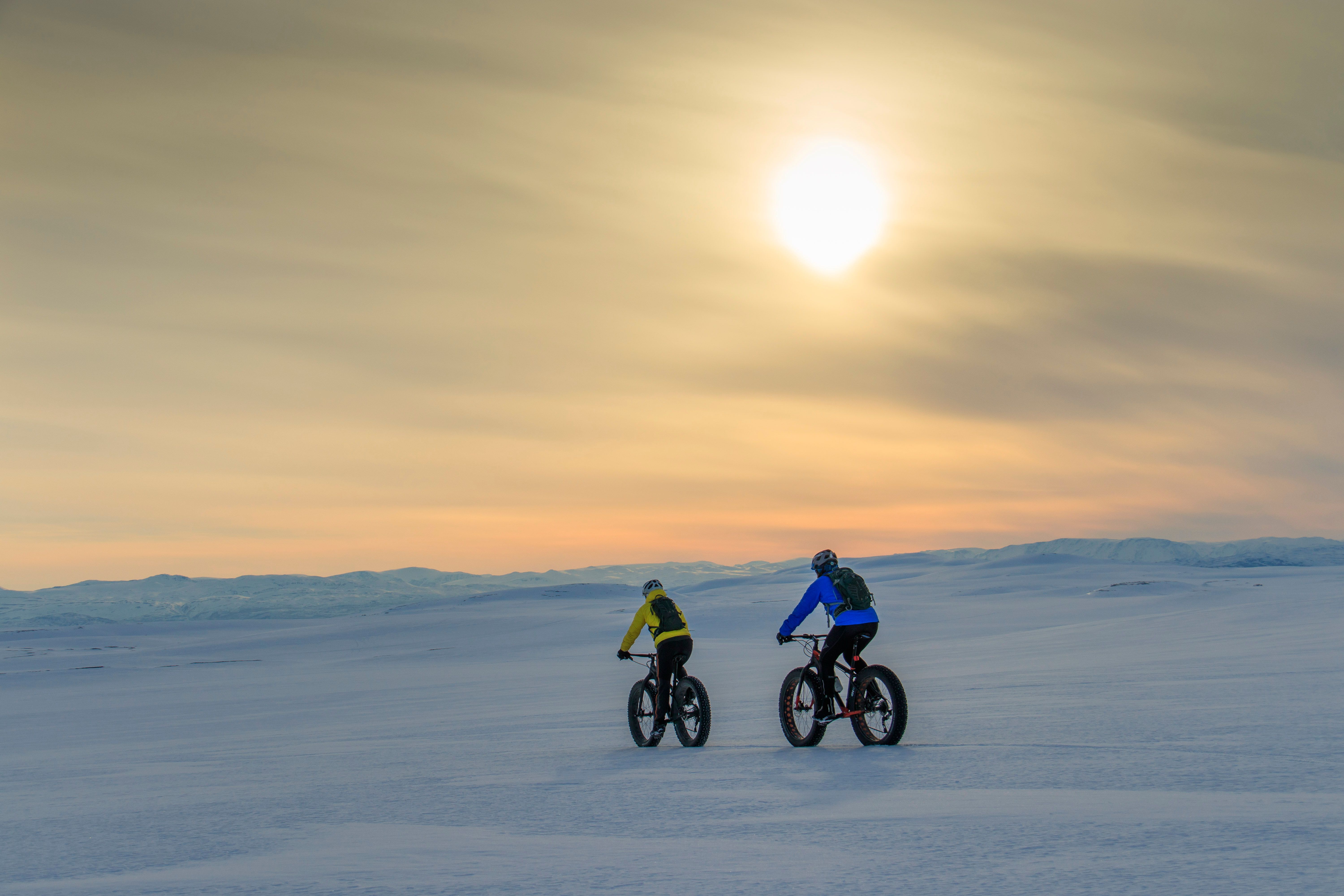People fatbiking in Finnmark, Norway.