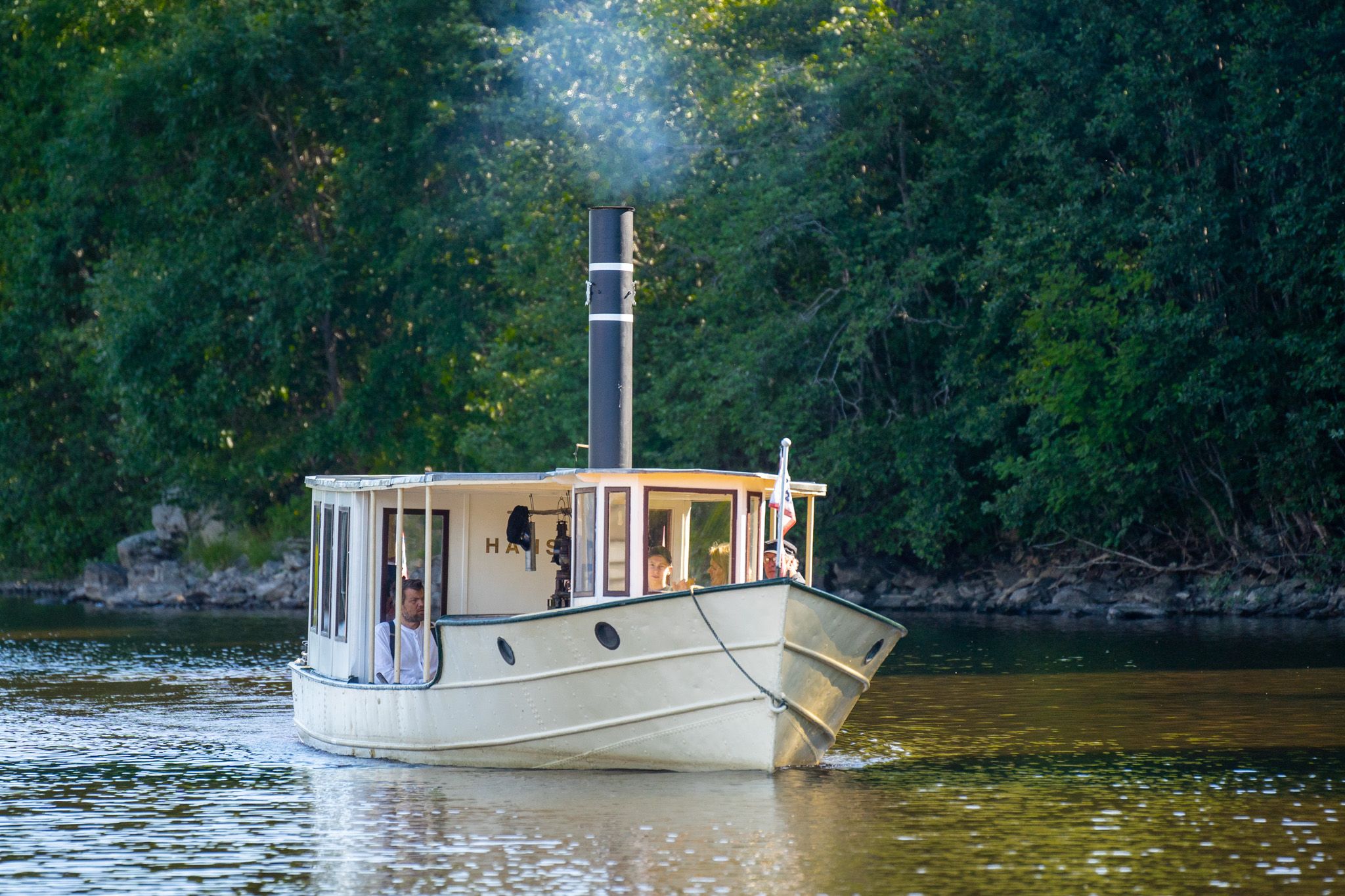 People on a mini-cruise with the D/S Hans on the Halden Canal in Eastern Norway.