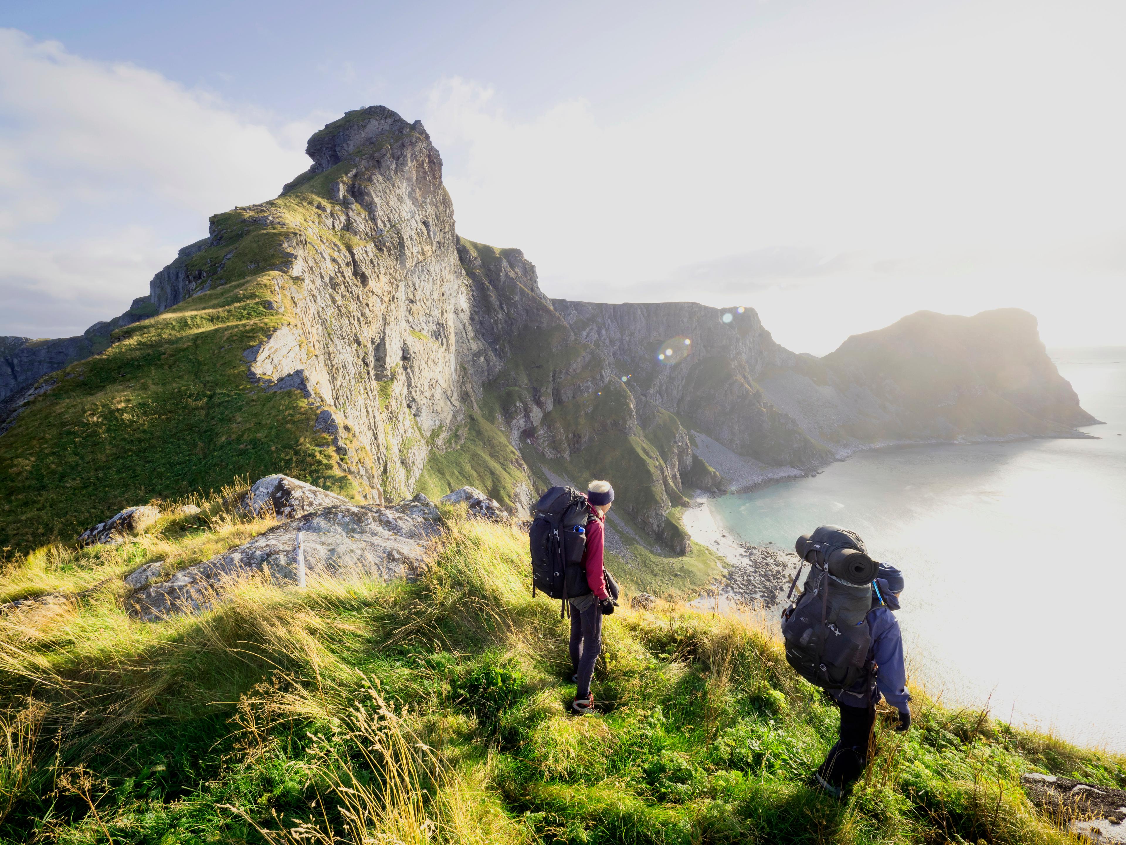 Two people hiking in Værøy in the Lofoten Islands in Northern Norway