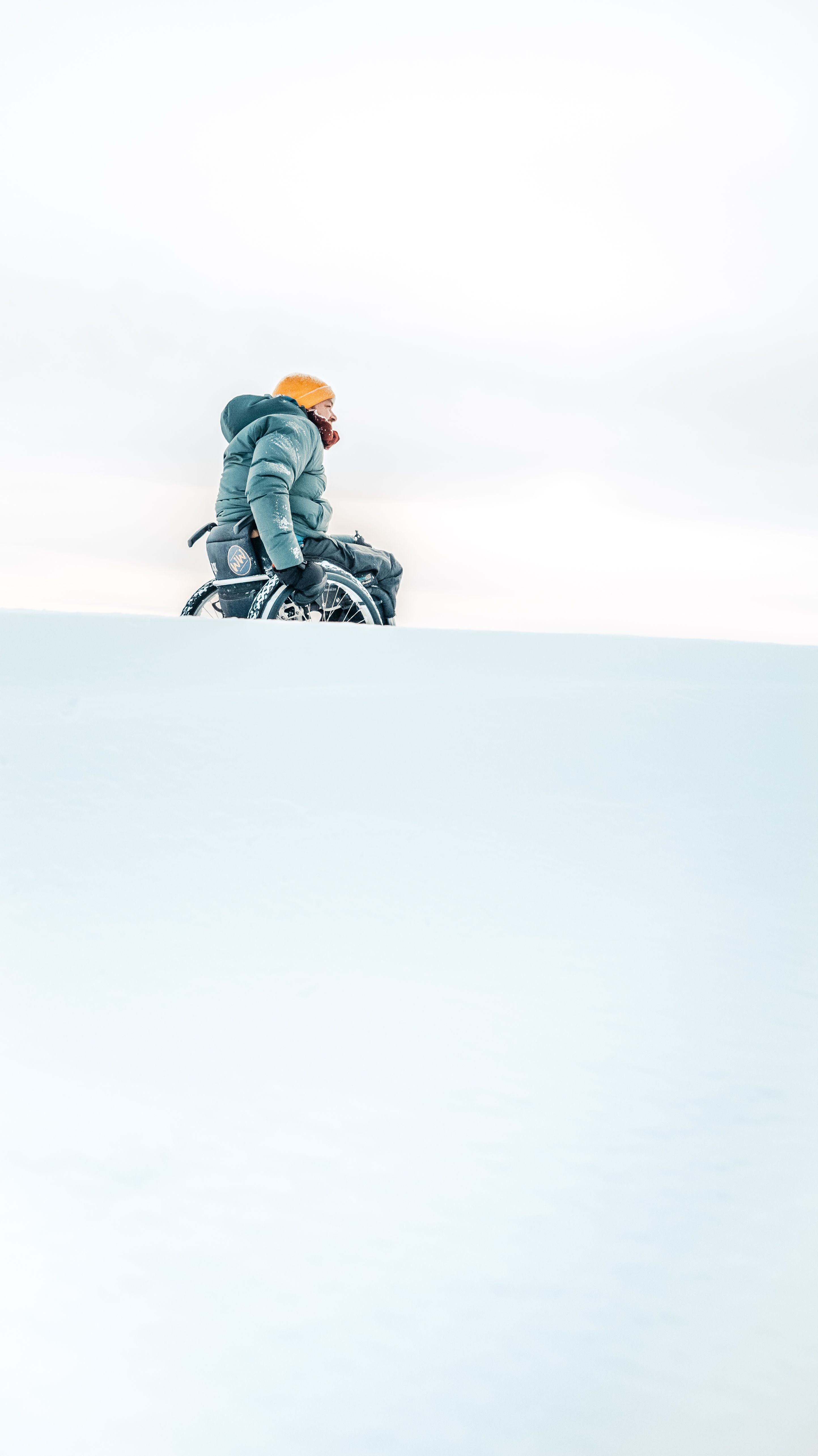 Man in a wheelchair in the snow