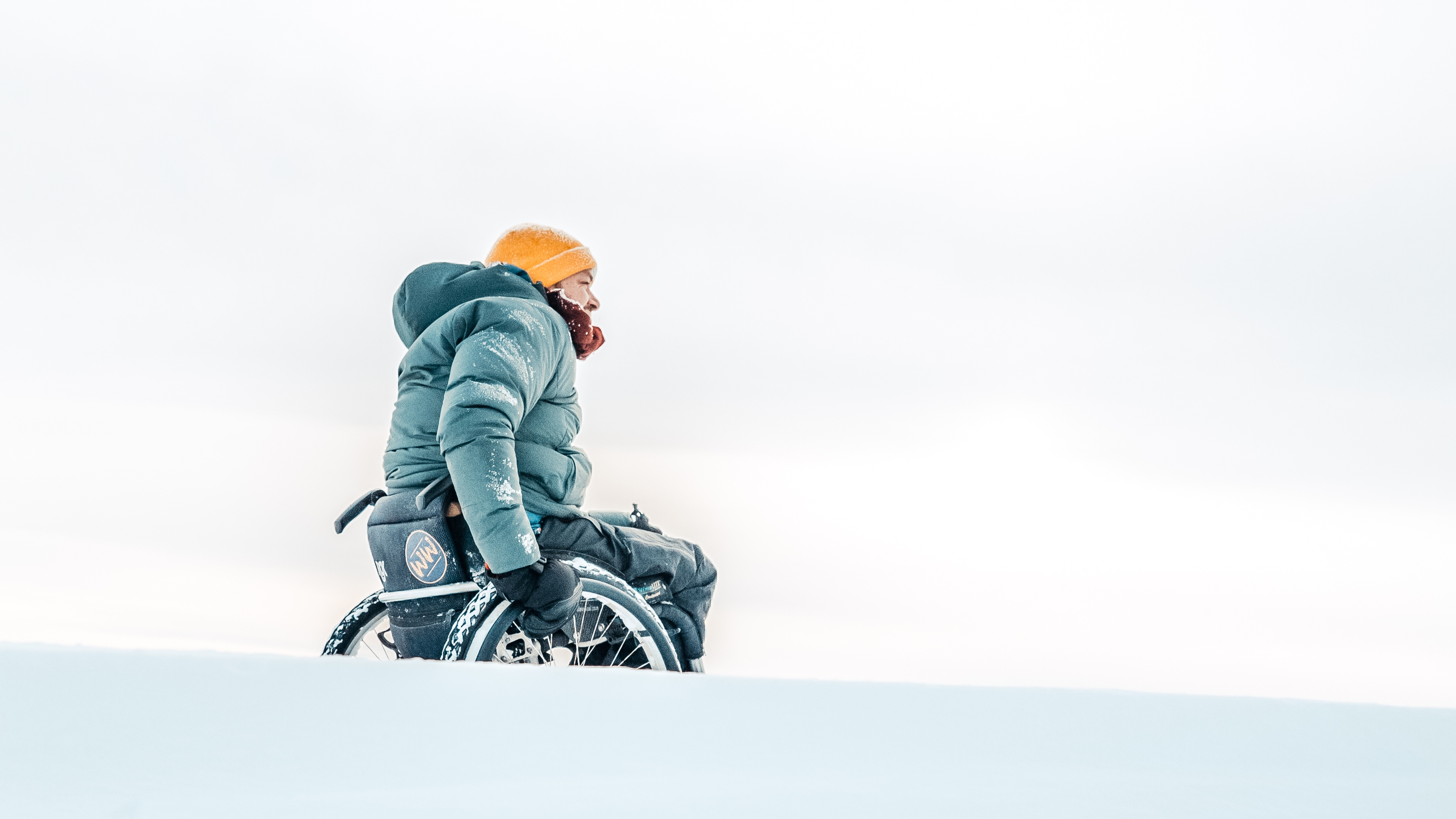 Man in a wheelchair in the snow