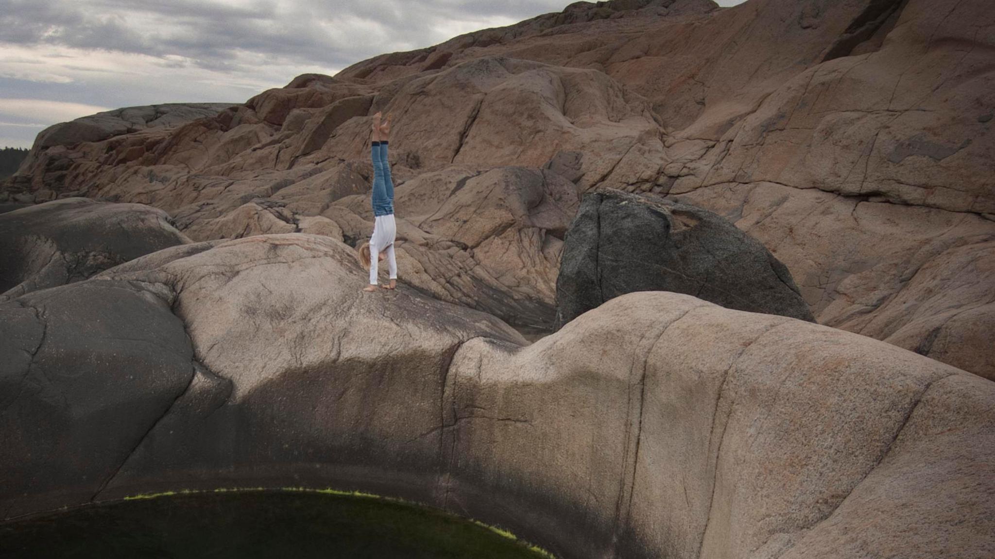 A person standing on the edge of a pothole at Sild in Risør, Southern Norway.