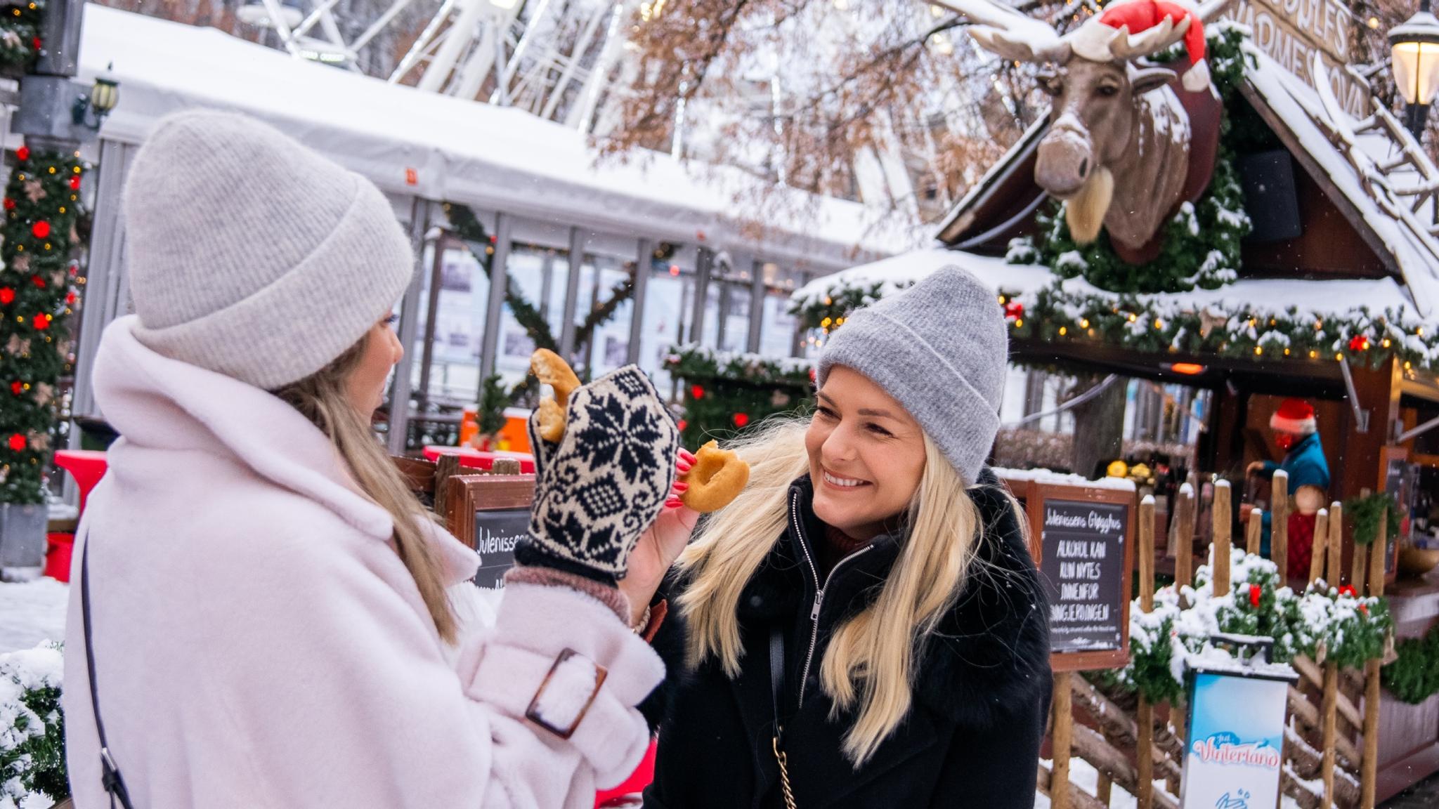 Two women at the Christmas market in Oslo, Eastern Norway