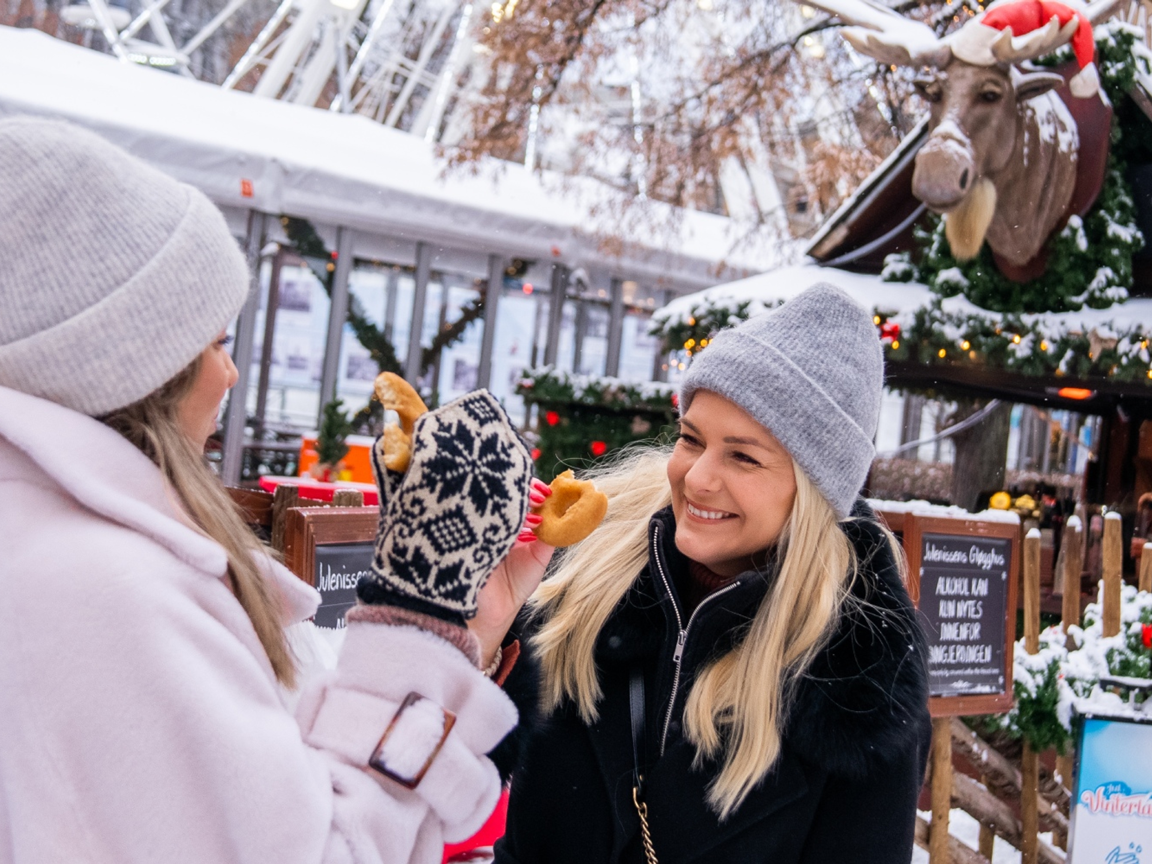 Two women at the Christmas market in Oslo, Eastern Norway