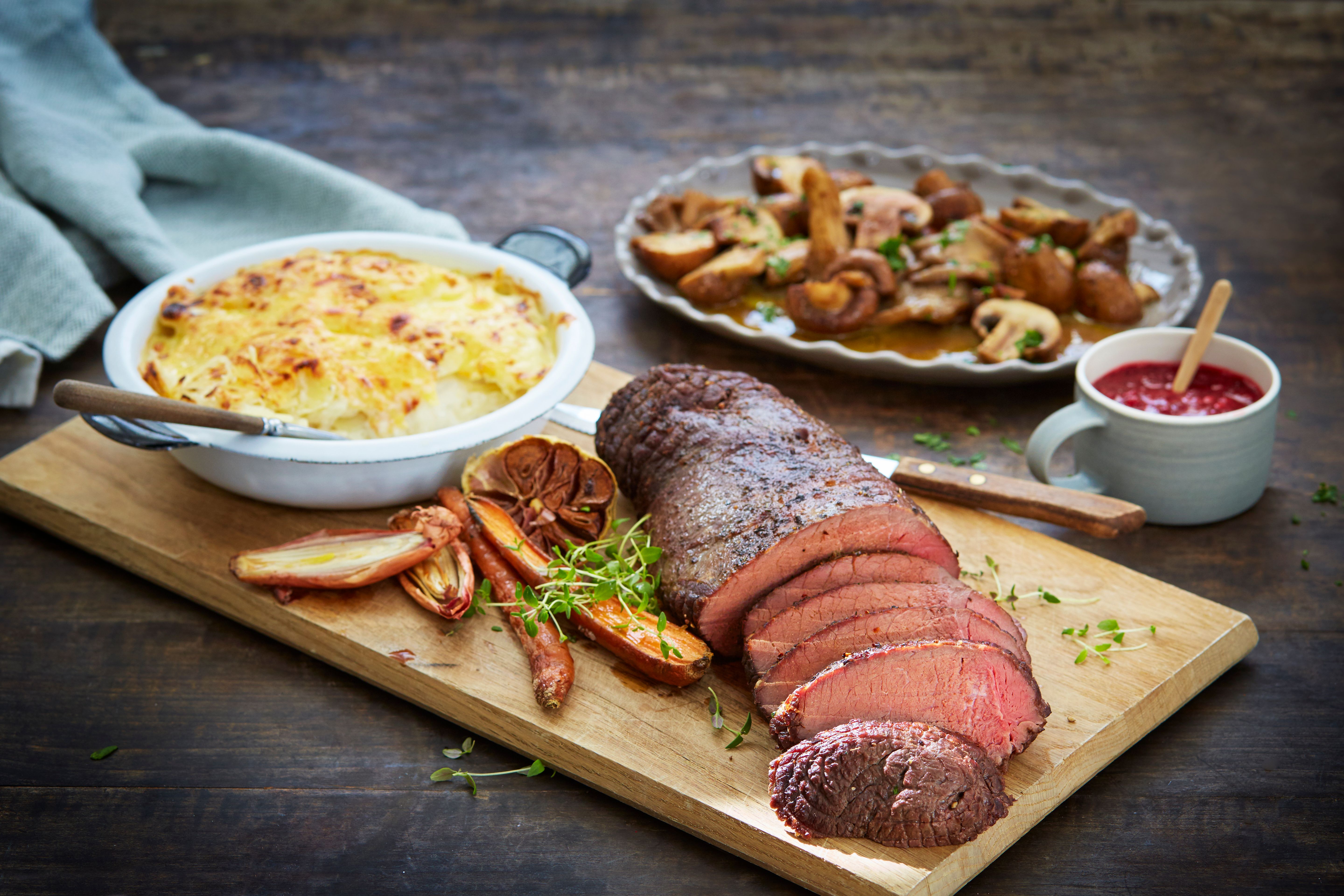 Traditional Norwegian venison steak, with potatoes, mushrooms, lingonberry jam