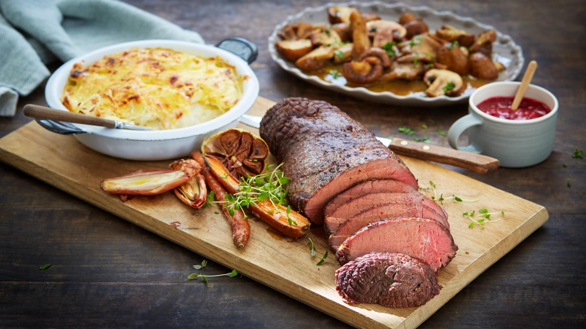 Traditional Norwegian venison steak, with potatoes, mushrooms, lingonberry jam