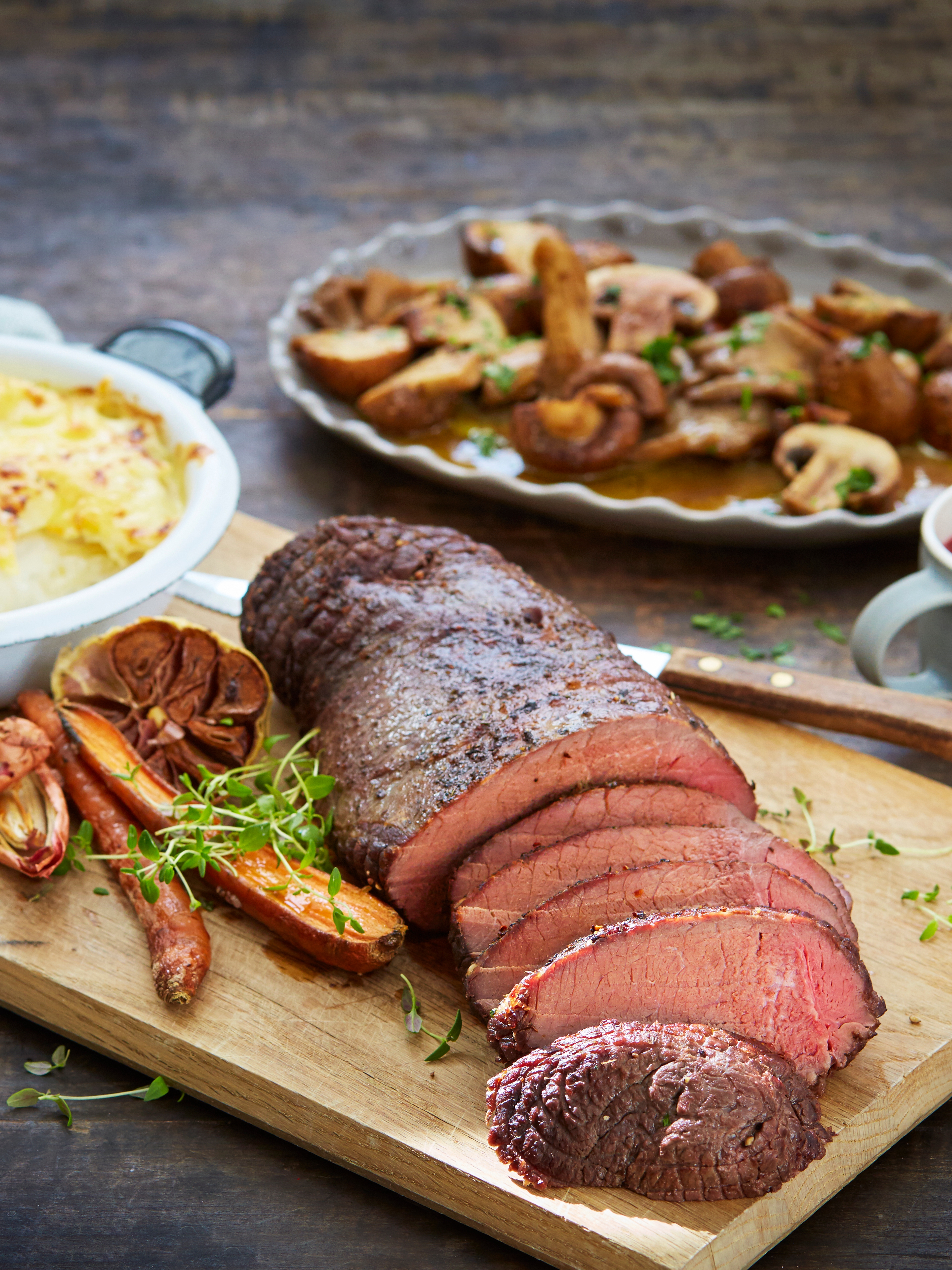 Traditional Norwegian venison steak, with potatoes, mushrooms, lingonberry jam