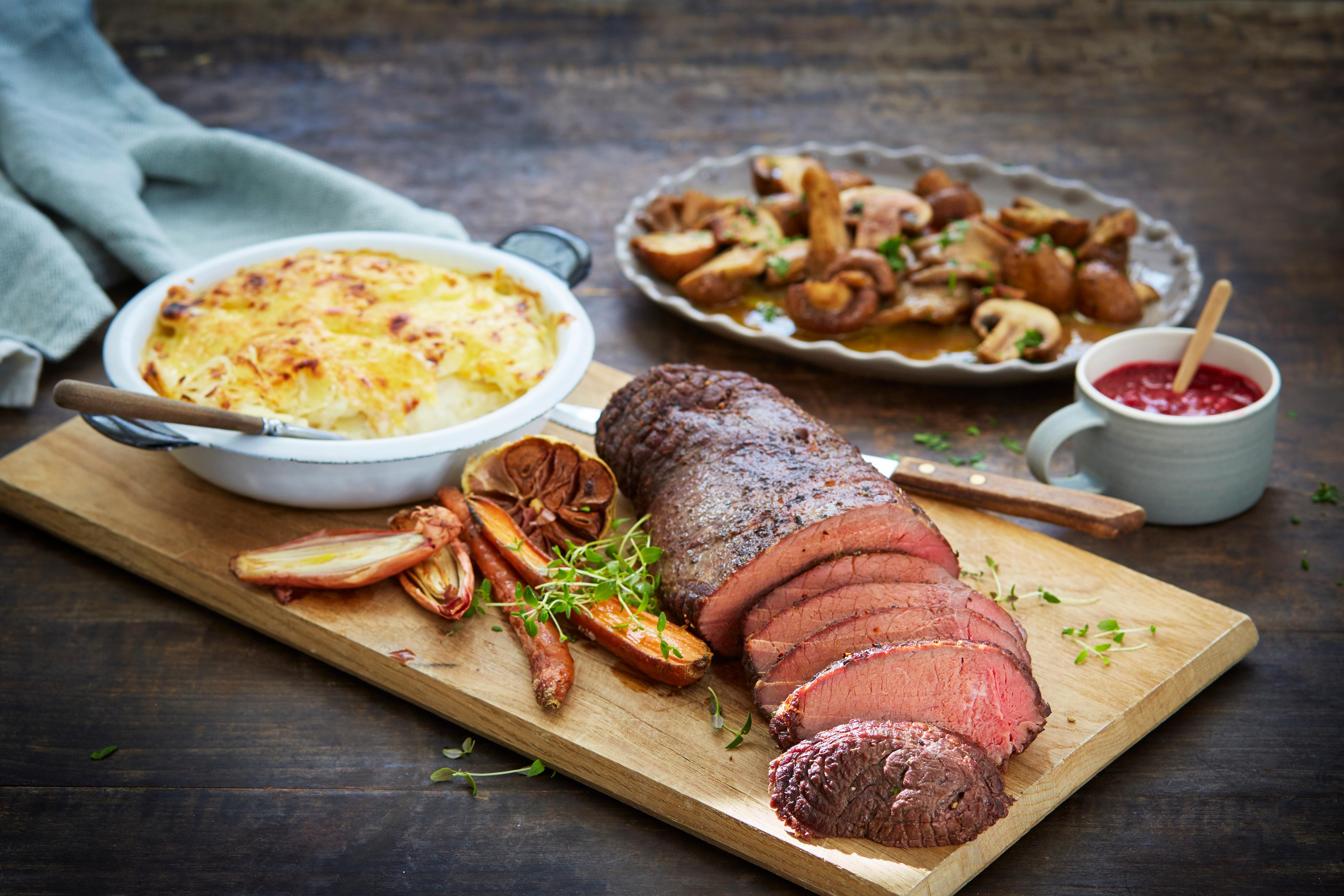 Traditional Norwegian venison steak, with potatoes, mushrooms, lingonberry jam