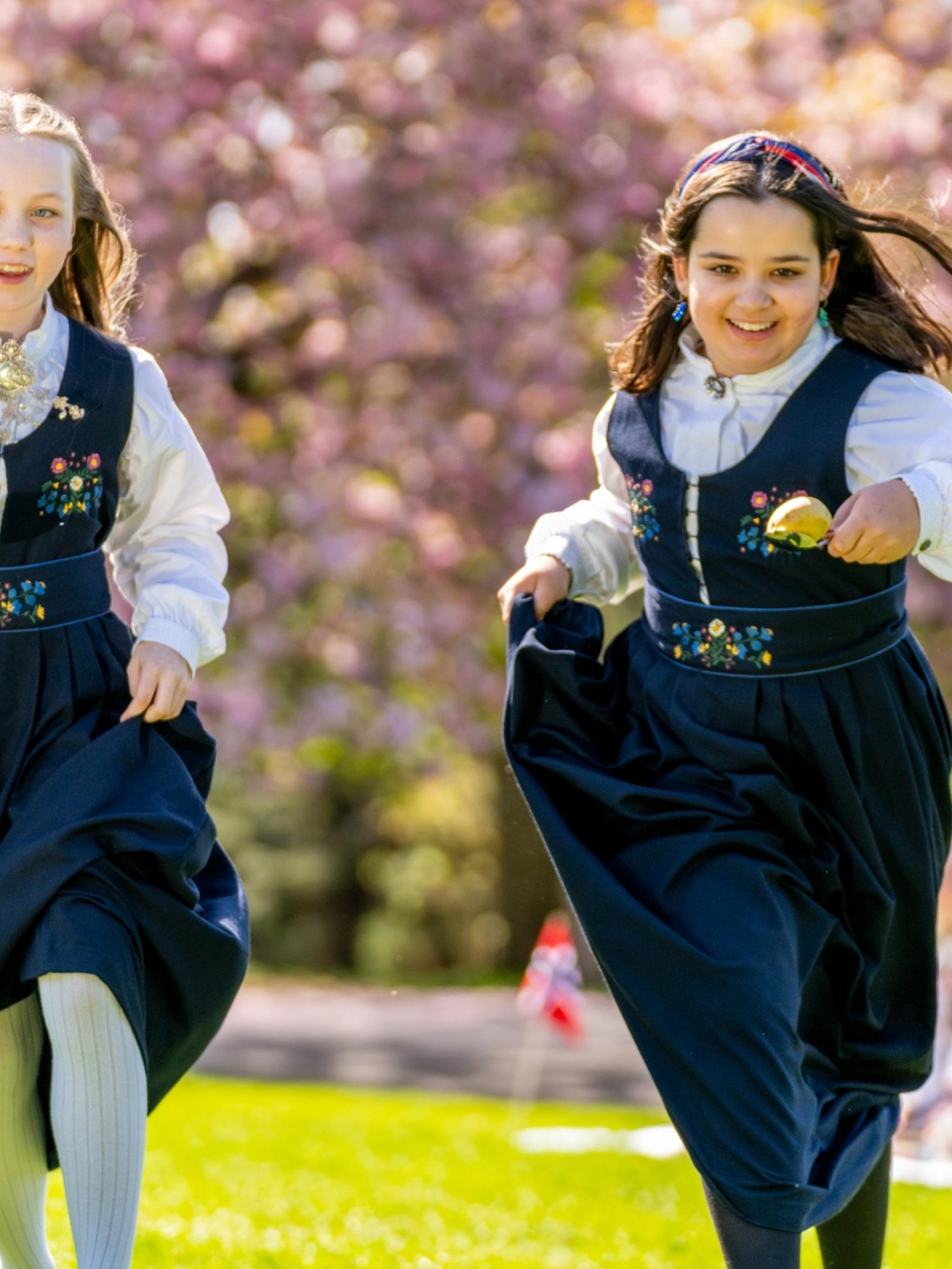 Two girls celebrating Norways constitution day, May 17th in a festdrakt costume