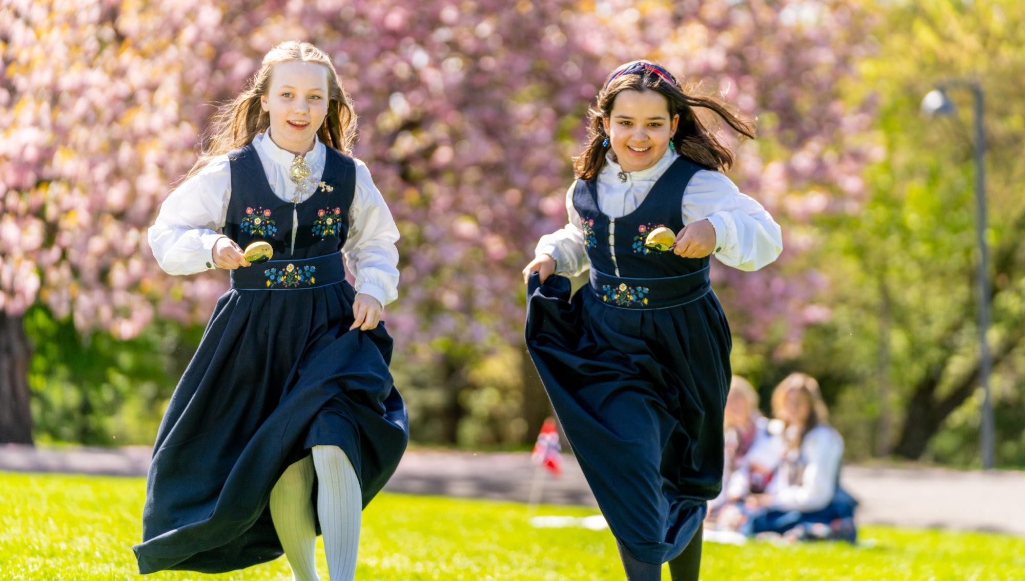 Two girls celebrating Norways constitution day, May 17th in a festdrakt costume
