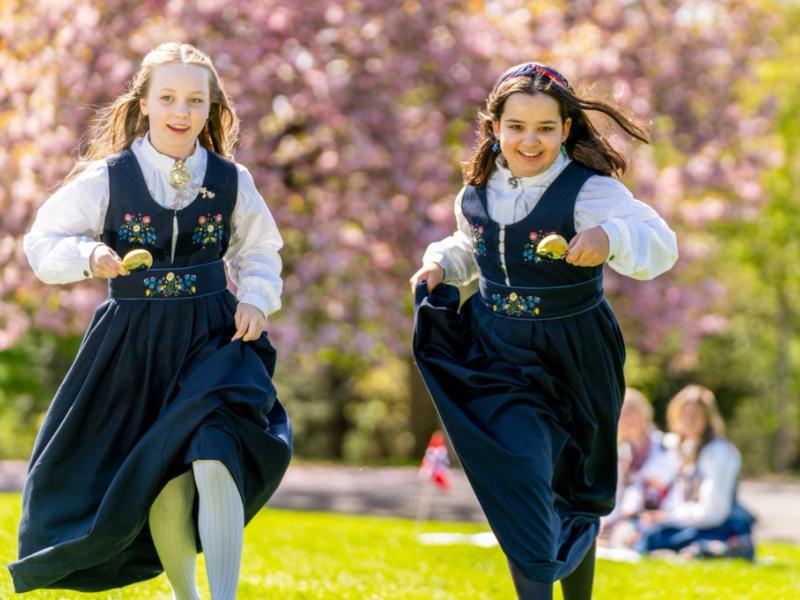 Two girls celebrating Norways constitution day, May 17th in a festdrakt costume