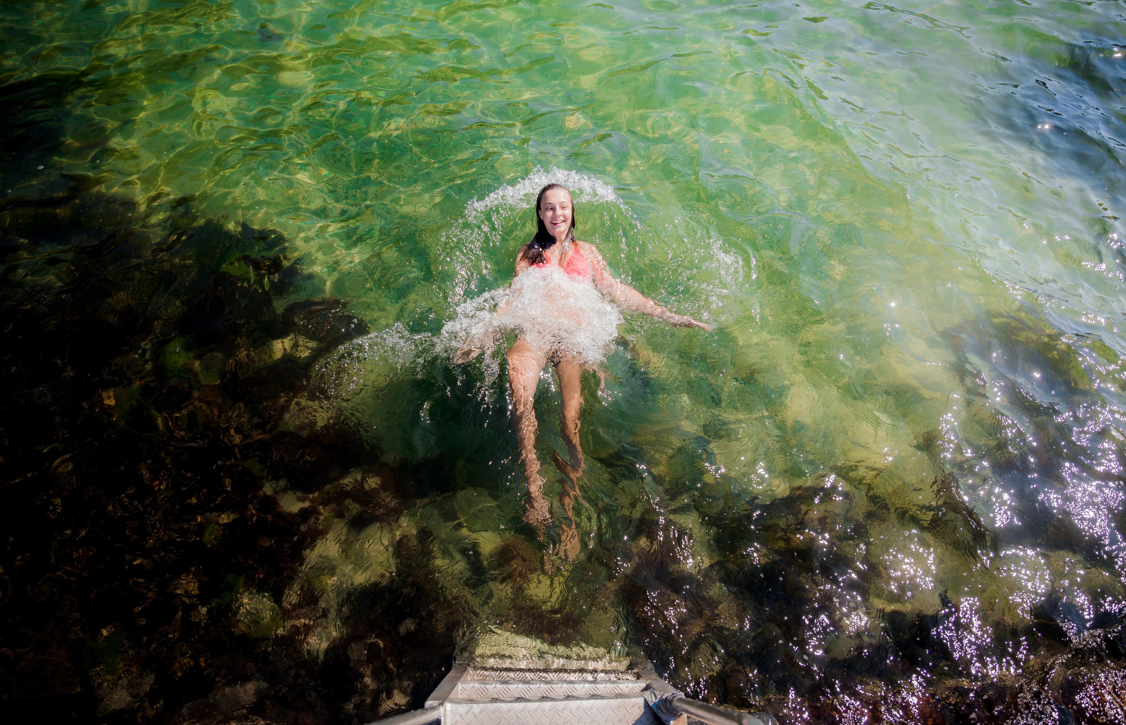 Girl swimming in the sea in Telemark, Eastern Norway