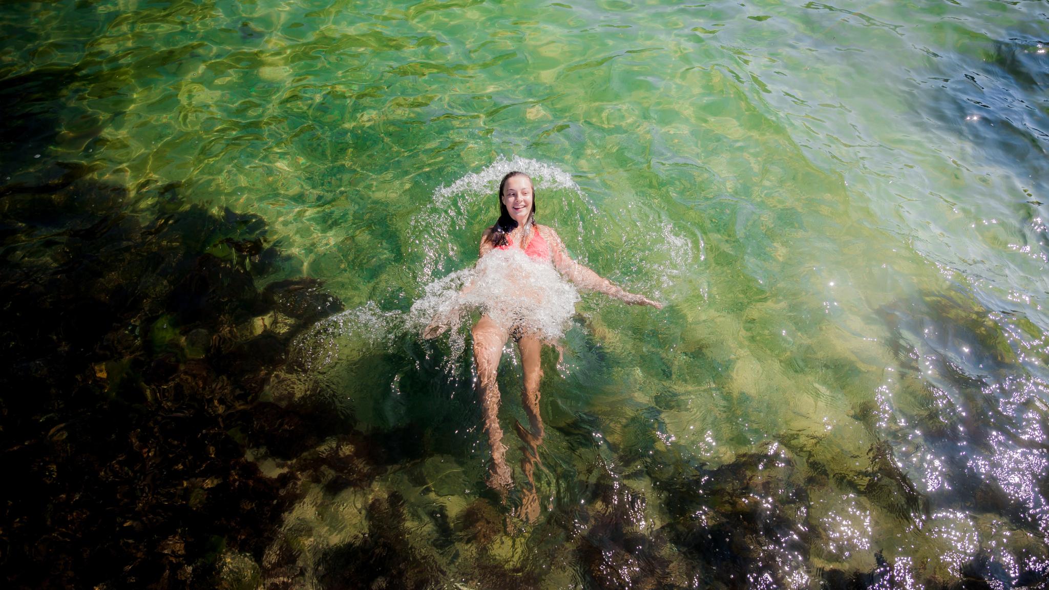 Girl swimming in the sea in Telemark, Eastern Norway