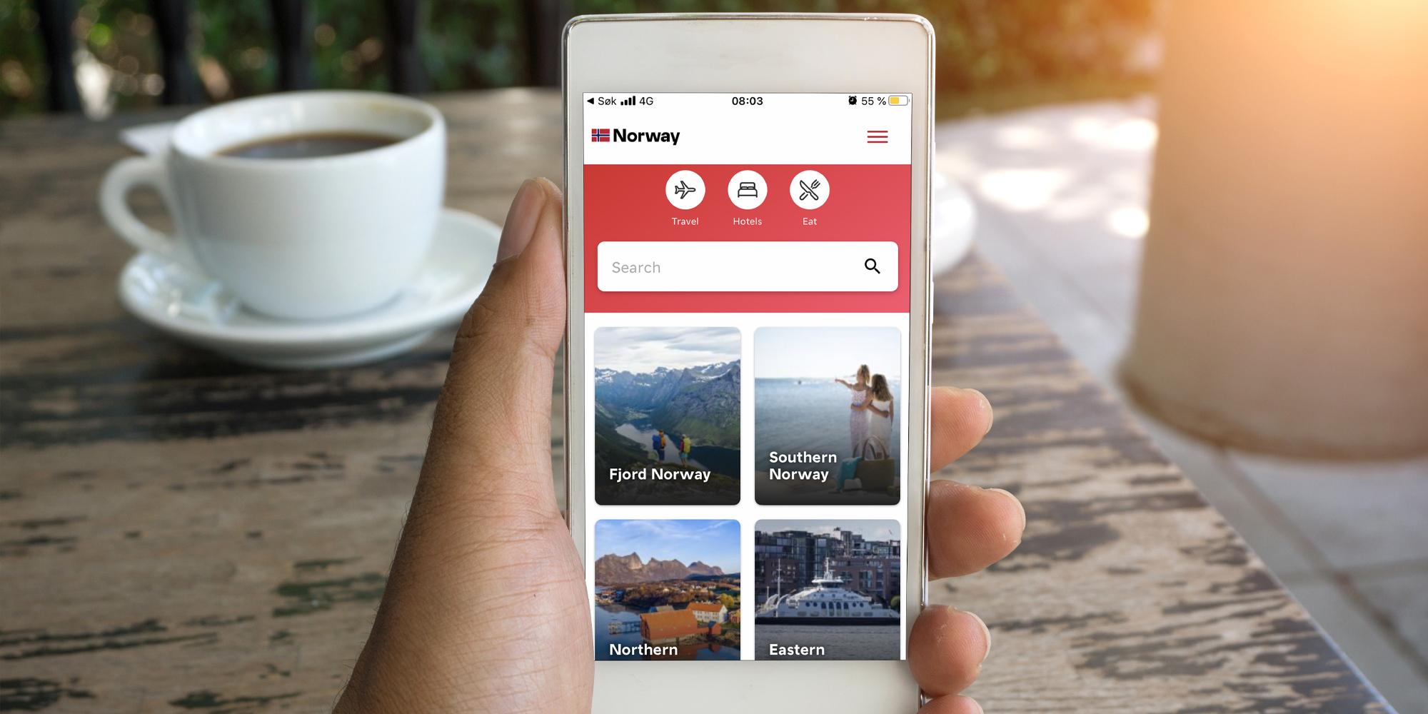 A person uses the Visit Norway app on a mobile phone