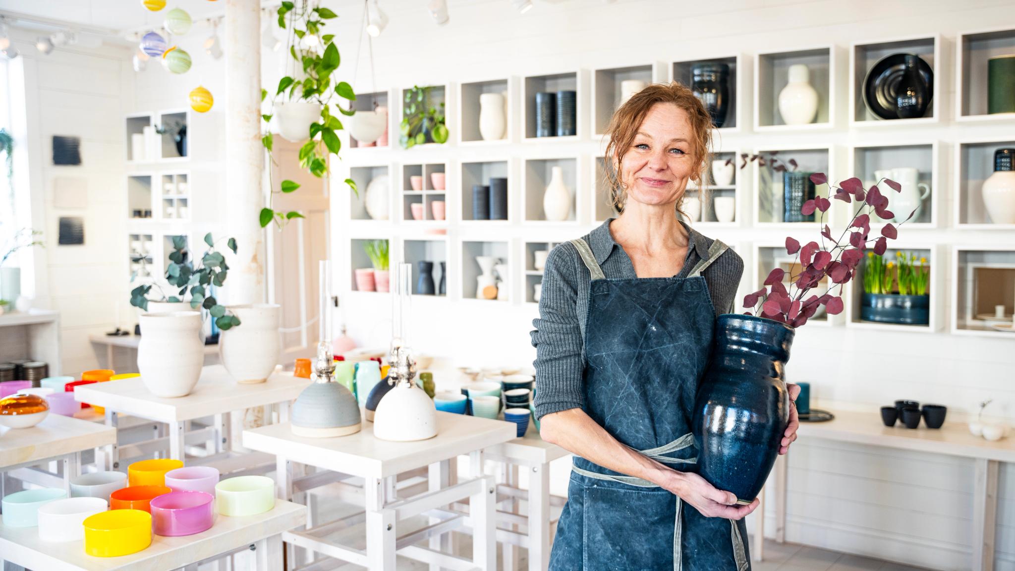 A pottery maker in her shop