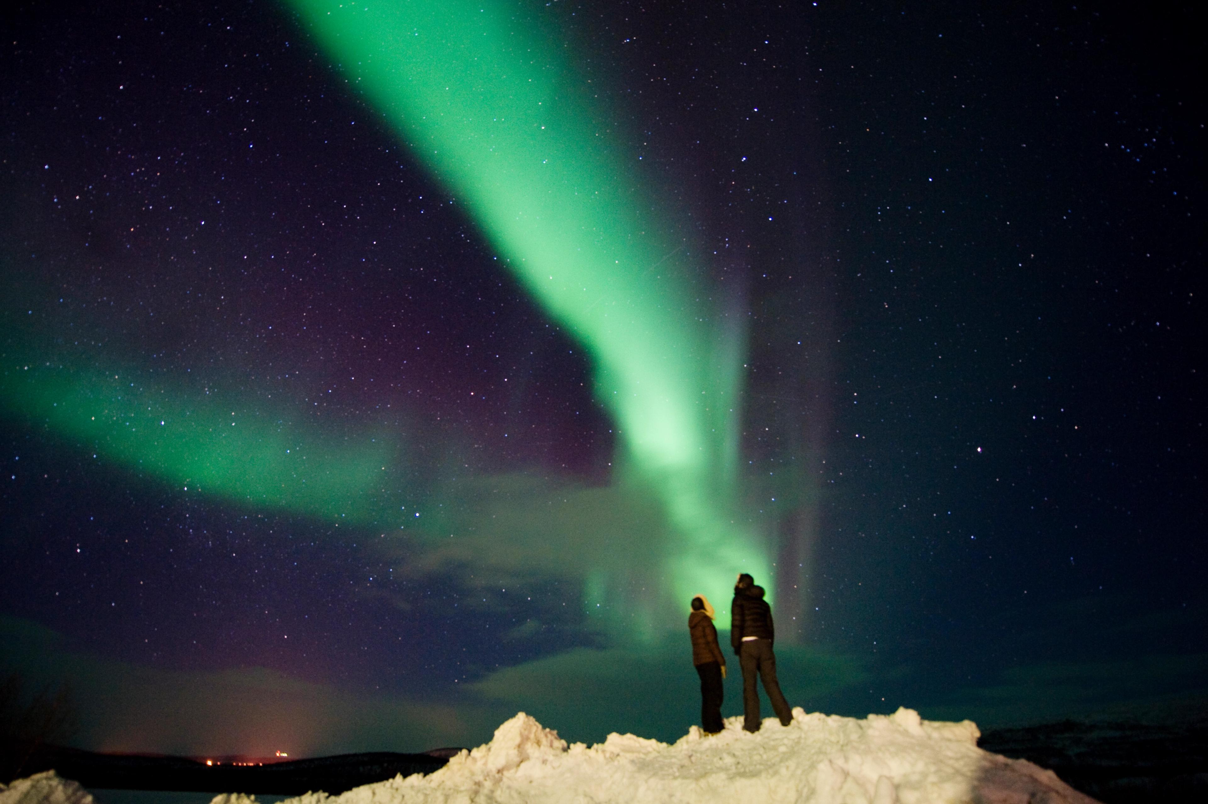 People looking at the northern lights in Finnmark
